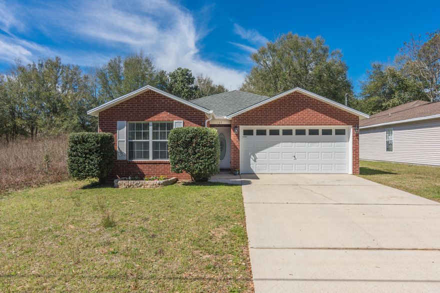 This charming 3 bedroom, 2 bathroom home is centrally located in Crestview. All new interior paint, new backsplash in kitchen, newly tiled master shower, and freshly landscaped! Popular split bedroom floor plan. The entry way, kitchen, dining room, and laundry room are all laminate flooring. Bedrooms and living room are carpeted. Bathrooms are tiled. Great back yard with a back patio perfect for grilling and letting the kids play. Quiet neighborhood in town!