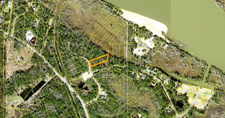 This one-acre wooded corner lot is nestled within the 90 acre River's Edge Subdivision. This is a private, gated community with paved roads and underground utilities in a serene and beautiful environment. There is a 1.4 acre common area of sand dune/beach along the Apalachicola River. This subdivision is located off of 12th street with easy access to the shopping and dinning of downtown Apalachicola. With multiple boating access points less than 10 minutes away, one is never far from some of the best fresh and saltwater fishing in Florida! Thirty minutes or less, to the world renowned, white sugar sand beaches of St George Island and Cape San Blas. Live the Forgotten Coast dream!