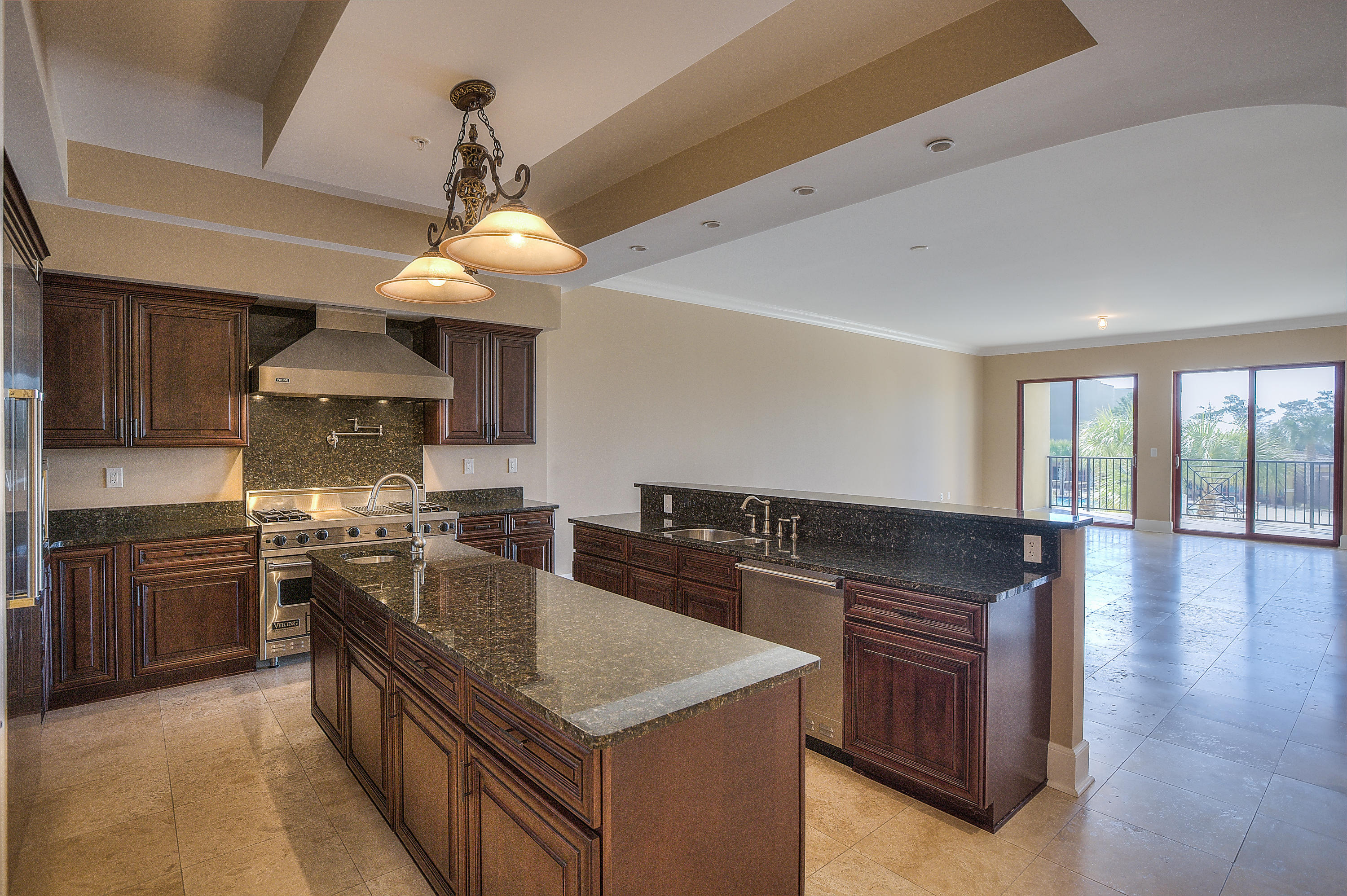 Lowest Priced Unit in the Luxurious ''Sanctuary by the Sea''. This balcony overlooks one of the three pools in the development. This unit includes 3 bedrooms, 3.5 Baths, travertine flooring, top of the line stainless steel appliances, a wine refrigerator, and 10' ceilings.Sanctuary by the Sea is located on 23 gulf front acres with a mere total of 82 units. The property is bordered to the south by approximately 650' on the Gulf of Mexico and the coastal dune, Big Redfish Lake to the west. The amenities of this development include 3 sparkling pools, lake access for Yolo Boarding, fishing or canoeing, a full workout facility, movie theater room, a virtual golf room, and underground parking. This is a must see unit.