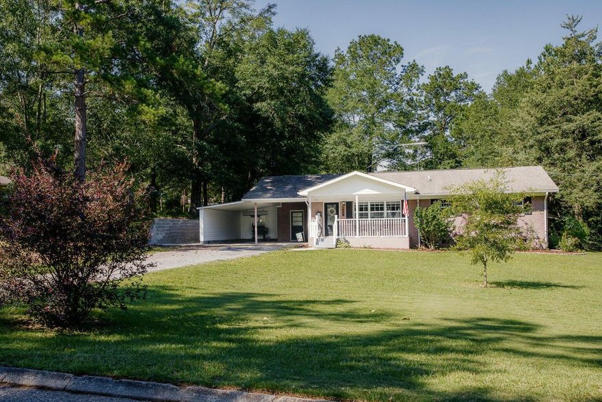 Who wants to live near a scenic lake? #KeepReadingCOUNTRY RETREAT that sits on just over half an acre-- IS NOW AVAILABLE.. and this one boasts NEW UPGRADES INSIDE AND OUT... AND A SWIMMING POOL!Welcome to highly desirable GREEN ACRES; a neighborhood known for its LUSH GREENERY, PEACEFUL VIBE AND SCENIC LAKE! This **ALL BRICK** 3 BR/2 BATH home offers curb appeal with the quintessential SOUTHERN FRONT PORCH and BEAUTIFUL GARDENS!Step inside to an OPEN CONCEPT DESIGN with spacious living room, neutral paint, crown molding and beautiful wood laminate flooring. The kitchen recently received a facelift and features newer appliances and brand new energy-efficient windows that fill the space with natural light. The family chef will enjoy the kitchen island with decorative pot rack hanging above.. and loads of counter and cabinet space!

The primary suite features crown molding, large windows and private bath with custom walk-in shower.

There are two additional guest bedrooms with generous-sized closets and plenty of room for large bedroom furnishings. 

The guest bathroom was tastefully updated with new vanity, custom subway-tiled shower.. and stylish ceramic tile flooring. 

BONUS: Indoor laundry (with additional storage) in the carport! 

Now let's talk backyard!

Step outside to your deluxe-sized custom deck that was made for entertainment and big enough for large outdoor furnishings! There's also a sparkling pool that friends and family will enjoy.  

Did I mention there is a barbeque station, firepit, POWERED MANCAVE/SHE SHED (with attached lean-to)... and the entire backyard features HURRICANE FENCING? Yep!

Other notable mentions-- NEWER HVAC AND WATER HEATER, UPDATED WINDOWS THROUGHOUT, RECENTLY INSTALLED GUTTERS... AND THE SELLERS ARE THROWING IN SEVERAL BOXES OF MATCHING TILE! #Freebies

This one is priced to move! Better hurry! Make an offer today!