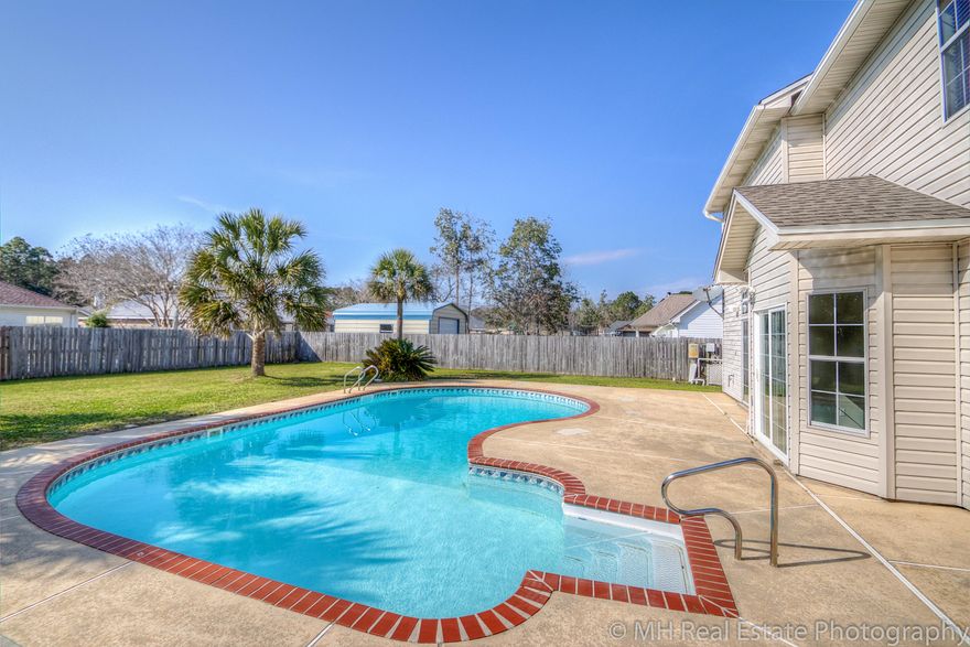 This fantastic home is located on a quiet cut-de-sac in the highly sought after neighborhood of Overbook. The home sits on a large .25 acre lot with a pool and still enough yard for a play set. It is 10 minutes from Hurlburt's back gate and 15 minutes to Eglin. This home boasts 27 foot ceilings in both of the living areas and foyer. Large sliders in dining room and great room that look out over the beautiful pool and backyard. Kitchen has hickory cabinets and granite counters. Bathrooms have granite counters as well. TWO new AC units and pool liner were installed in 2012. Roof was replaced in May 2014. New hot water heater in 2016. Freshly painted this month. X FLOOD ZONE - no flood insurance necessary