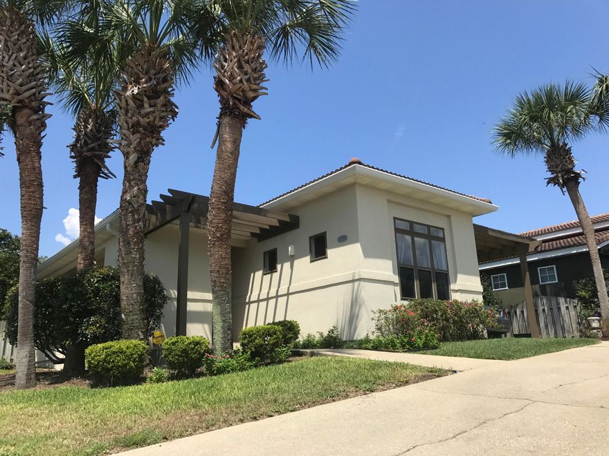 One of only 45 homes in gated Tuscany. A must see! Several interested buyers have said the home feels bigger than pictured & shows great. Won't last long. Located south of 98, near Destin Commons, Mid-Bay Bridge, and the Mirarmar Beach beach access. This home has hard floors throughout, recessed lighting, ceiling fans, high ceilings, deep crown molding & baseboards, built in book shelves in living, custom cabinet in kitchen, and lots of light! Fresh interior paint & recent exterior paint. Low maintenance, well maintained w/ fenced yard, covered patio, covered carport. Exterior utility room for storage, Sprinkler system, alarm system, and WiFi thermostat for remote monitoring of A/C & water heater while away. No Flood Insurance Required! Private community pool & low HOA fee!