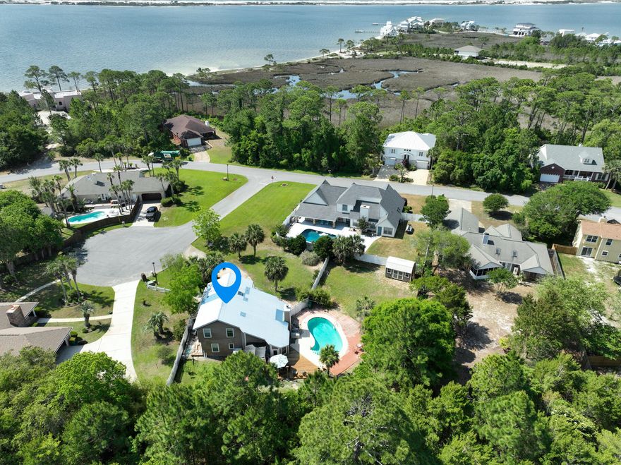 Welcome to Paradise Living! Great family home in sought after Waterfront Community! Extra large backyard features Gunite in ground pool along with a new privacy fence. Exclusive Waterfront Living; A Hidden Gem;  Discover unparalleled coastal elegance in this 4-bedroom, 3-bath home nestled in a sought-after waterfront community with deeded water access to the Sound. Designed for both relaxation and entertainment, this home boasts a gunite in-ground pool, large decks, new shed or workshop; Home features ceramic tile floors downstairs with new LVP upstairs; Kitchen features upgraded beautiful grey granite countertops, a gourmet kitchen with a 6-burner vented gas stove, Stainless appliances, white cabinets, back splash, track and drop lighting; Features: new vanities, new toilets, new LVP flooring upstairs; 7 large windows in the main living area give an abundance of light; Plus 2 bay windows in Living and Breakfast Area give cozy atmosphere; Large bonus room downstairs that is heated and cooled for additional room for entertaining friends and family; One of the upstairs bedrooms includes a bonus room attached; Full upstairs bath boosts new fixtures; the metal roof will add years and help on insurance; recent 4 pt and wind mit gave 20 more years to roof life; or low maintenance insurance costs; The master suite is a true retreat, featuring a Jacuzzi tub, double vanities; Cozy up by the gas fireplace, or enjoy the versatility of a separate playroom and additional living space downstairs. Bonus Room that is heated and cooled, could be converted back to a garage; All new iring for pool pump, pool pump 3 years; New irrigation system with new box; Complete with a new fence, voluntary HOA, and ample space for family and guests, this home offers the perfect blend of coastal charm, modern luxury, and unbeatable access to the Sound. Don't miss this rare opportunity to own a home in a great water access community! Other Notes: The flooring has been changed throughout the house upstairs and downstairs with the exception of the small bedroom. The staircase has been stripped of carpet down to the wood and refinished. The irrigation pump was also replaced in 2024 along with all irrigation lines. Some windows have been replaced and a new sliding door off the master to the deck. New pool pump, water heater, condenser, garbage disposal, vanities, toilets and faucets: Entire wood fence around the property in the backyard replaced 2 years ago and treated with 6 yr water proofing as well as the decks. Complete new siding on chimney. Replaced exhaust fans in BR and all water shut off valves and hoses in 2025.
Water Heater 2020; HVAC condenser 2023; Irrigation Pump 2023; New Pool pump - 2018; Roof Metal;
Voluntarily HOA. $$225 annual fee. Community Beach (HOA
Come view this home in a great subdivision of Emerald Point! 