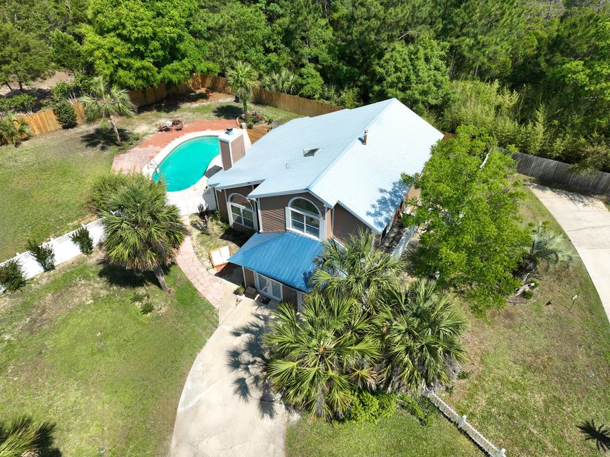 Welcome to Paradise Living! Great family home in sought after Waterfront Community! Extra large backyard features Gunite in ground pool along with a new privacy fence. Exclusive Waterfront Living;   Discover unparalleled coastal elegance in this POOL home nestled in a sought-after waterfront community with deeded water access to the Sound. Designed for both relaxation and entertainment, this home boasts a gunite in-ground pool, large decks, new shed or workshop; Home features ceramic tile floors downstairs with new LVP upstairs; Kitchen features upgraded beautiful grey granite countertops, a gourmet kitchen with a 6-burner vented gas stove, Stainless appliances, Double convection oven, white cabinets, new back splash, track and drop lighting; Features: new vanities, new toilets, new LVP flooring upstairs; 7 large windows in the main living area give an abundance of light; Plus 2 bay windows in Living and Breakfast Area give cozy atmosphere; Large bonus room downstairs that is heated and cooled for additional room for entertaining friends and family; One of the upstairs bedrooms includes a bonus room attached; Full upstairs bath boosts new fixtures; the metal roof will add years and help on insurance; recent 4 pt and wind mit gave 20 more years to roof life; or low maintenance insurance costs; The master suite is a true retreat, featuring a Jacuzzi tub, double vanities; Cozy up by the wood burning fireplace, or enjoy the versatility of a separate playroom and additional living space downstairs. Bonus Room that is heated and cooled, could be converted back to a garage; All new wiring for pool pump, pool pump 3 years; New irrigation system with new box; Complete with a new fence, voluntary HOA, and ample space for family and guests, this home offers the perfect blend of coastal charm, modern luxury, and unbeatable access to the Sound. Don't miss this rare opportunity to own a home in a great water access community! Other Notes: The flooring has been changed throughout the house upstairs and downstairs with the exception of the small bedroom. The staircase has been stripped of carpet down to the wood and refinished. The irrigation pump was also replaced in 2023 along with all irrigation lines. Some windows have been replaced and a new sliding door off the master to the deck. New pool pump, water heater, condenser, garbage disposal, vanities, toilets and faucets: Entire wood fence around the property in the backyard replaced 2 years ago and treated with 6 yr water proofing as well as the decks. Complete new siding on chimney. Replaced exhaust fans in BR and all water shut off valves and hoses in 2025.
Water Heater 2020; HVAC condenser 2023; Irrigation Pump 2023; New Pool pump - 2018; Roof Metal;
Voluntarily HOA. $$225 annual fee. Community Beach (HOA
Come view this home in a great subdivision of Emerald Point! 