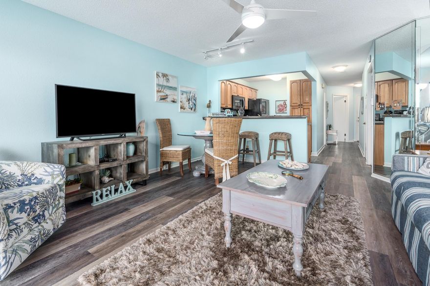 Rare opportunity for a townhouse condo in the Lakefront area of Seascape.  Recently updated 2BR+/2BA unit on the lakefront, just steps to the beach access, one of five community pools, and with a freshwater fishing lake directly behind the condo.  Screened in decks on both the main level and off the MBR offer fabulous lake and golf course views.  The entire second level is the over 500 sf master suite, with vaulted ceiling, private deck, and master bath with a 5' jacuzzi tub, separate shower and lavatory, and 12 feet of full length closets.  The main level has solid surface flooring in a freshly renovated living room, dining area, kitchen with breakfast bar, and a guest BR with an attached full bath.  There is also a 15 X 13 ''bonus room'' upstairs for storage or an extra kid's bedroom.