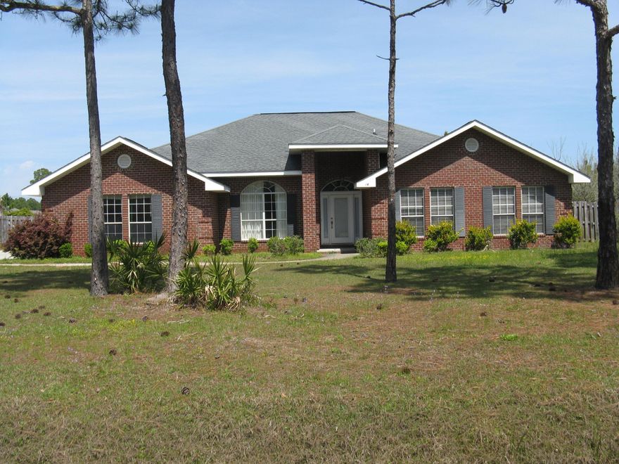 All brick house located on a large lot in Driftwood Estates. Large family room with vaulted ceilings, kitchen has Corian counters, tile backsplash, center island, lots of cabinets and a separate, spacious pantry area. Large fenced backyard with room for a pool. Large master bedroom and master bath. Whirlpool tub and his and her closets in master bath. Selling as-is. Room dimensions are approximate. REO foreclosure.