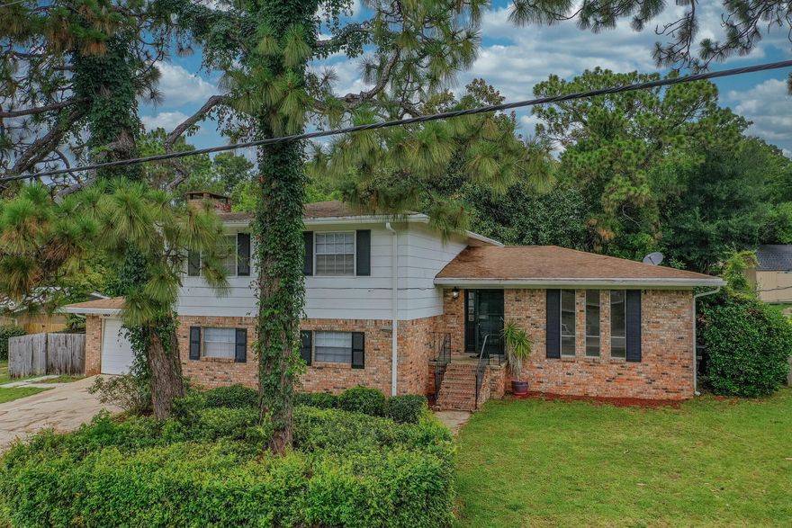 Located in the highly desired Poquito Bayou (Shalimar) community - This one is a MUST SEE! This 5 bedroom brick home showcases 2 kitchens and a 2 car garage. Conveniently located near BOTH military bases, restaurants and the neighborhood family park which hosts a boat launch and its access to the bay! The 1st level has an oversized living room/dining room area, a Full Kitchen, a bedroom, Full bathroom + Fireplace! 2nd Level features a dining room, living room + large kitchen! Set in place on the the 3rd level is 4 bedrooms + multiple bathrooms! Looking for a place for the family to gather? The deluxe sized backyard is perfect for outdoor adventures, BBQ or adding a pool! This home is perfect for the whole family! Bring your family home!