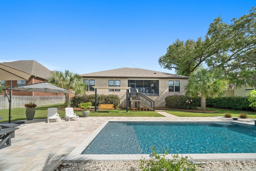 CURRENTLY UNDER CONTRACT. SELLER ACCEPTING BACK UP OFFERS. This exquisite one-story, contemporary residence, built in 2019, is positioned perfectly in the Historic Cove neighborhood and offers a PRIVATE HEATED POOL with 2,975 square feet of luxurious living space!This is a remarkable find with 3 bedrooms, an oversized bonus room, 3-car garage, and pool on a single level! This home is situated in the Cove, a quaint, golf cart-friendly neighborhood, with streets lined by hundred-year-old oak trees, sidewalks and providing a serene backdrop for a comfortable life in a great community. Just a short golf cart ride away, the vibrant downtown Panama City are awaits, offering an array of restaurants, boutique shopping, breweries, and more. The streets are filled with kids riding bikes, neighbors walking and community events year-round yet still offers a cozy, quaint setting.

Upon approach, you'll notice this community offers underground utilities and this home that has a lovely pavered driveway, lush landscaping and a 3-car garage. Step inside to discover a spacious foyer and a great room that boasts soaring vaulted ceilings adorned with beams, creating an open and inviting atmosphere looking over the private, heated pool. The expansive kitchen is a chef's dream, featuring a large island, gas cooktop, French door refrigerator, double ovens and a walk-in pantry with ample space for storage and growth with customization. The dining room overlooks the beautiful pool area great for parties and family gatherings. No level of detail was left out with the design of this single level home.

A 14' x 18' flex/bonus room off the great room provides versatility for various uses, whether as a home office, private gym, play room or entertainment space. With the size of this room, it can also easily be made into a fourth bedroom. Step into the living area with vaulted beamed ceilings and open the stacking, 8' tall sliding glass doors seamlessly connecting the living area to the screened covered porch. The screened porch offers an incredible summer kitchen with a stylish granite backsplash and countertop with grill and overlooks the newly-constructed saltwater, private, heated pool with a waterfall and sun shelf for lounging. Having the pool heated offers endless days and nights year-round to enjoy the Florida outdoors! This backyard was completely reimagined into a true oasis and is perfect for pool parties, neighborhood cookouts, and enjoying sunsets poolside. Luxurious landscaping and a grilling area enhance the outdoor experience while overlooking the gorgeous waters of Watson Bayou. 

This home offers a split floor plan with three bedrooms, three bathrooms and a flex/bonus room. The dreamy primary suite is a true retreat, complete with dual walk-in closets with built-in closet systems, a soaking tub, a walk-in shower, and large expansive vanities, including a makeup vanity area. Generous-sized windows in the primary suite offer picturesque water views of Watson Bayou. Two spacious guest bedrooms on the opposite side of the home provide privacy from the primary suite. One bedroom is complete with a guest bath serving as an en suite featuring a tile shower/tub combo, while the other guest bath, with a tiled walk-in shower, is adjacent to the additional guest bedroom and just off the hallway-convenient for entertaining and guests.

The property also includes a large mudroom for storage and laundry with a sink and counterspace just off access to the three-car garage, ensuring functionality for a families activities. 

Residents of the Cove neighborhood enjoy access to multiple newly renovated city parks & playgrounds overlooking the water, as well as a public boat ramp just around the corner, making it ideal for outdoor enthusiasts. 

This exceptional property is your opportunity to own a piece of paradise in one of Panama City's most desirable neighborhoods, The Cove. 