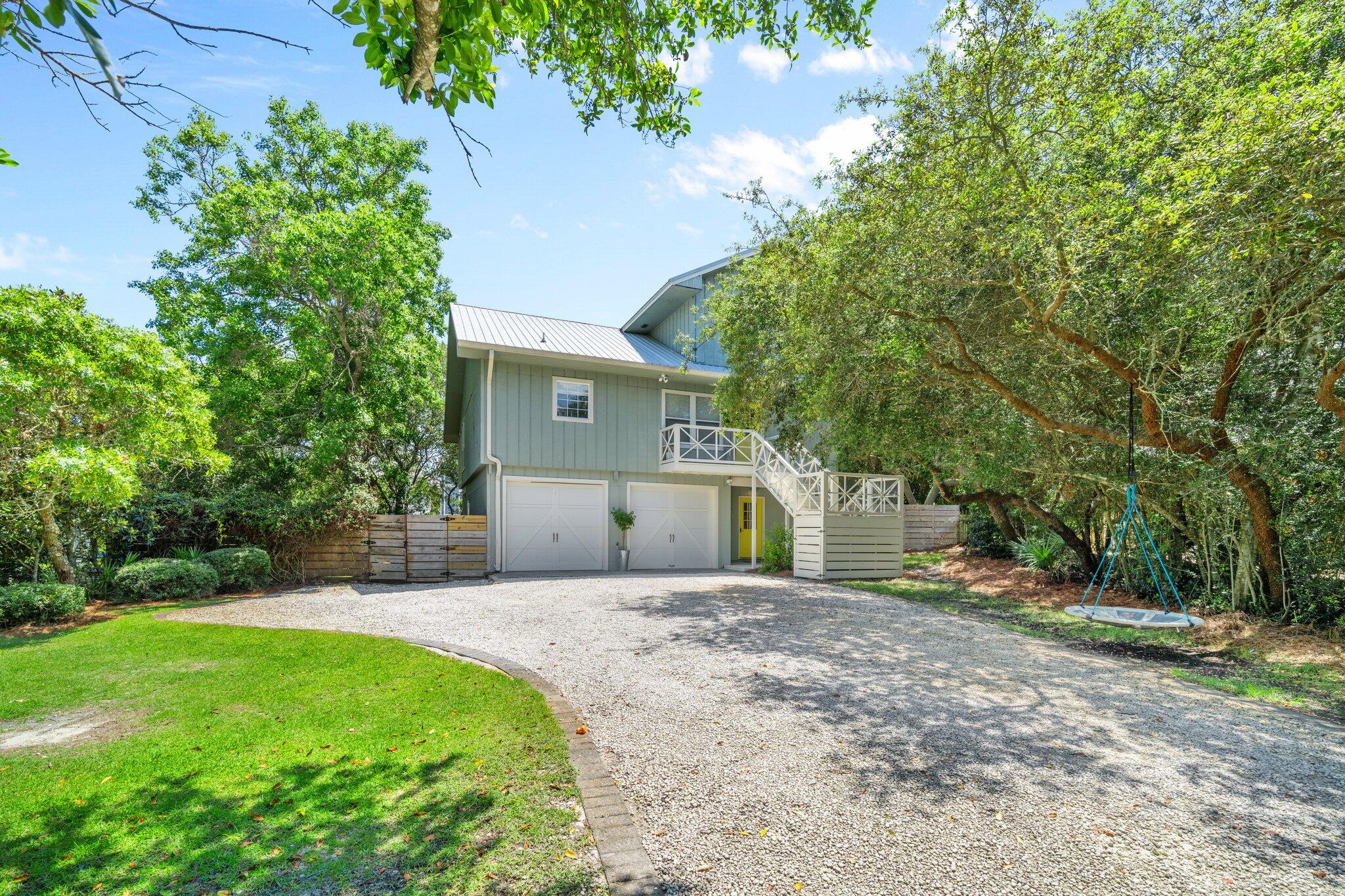 Situated on a spacious quarter-acre lot in the desirable Dune Allen Beach community, this 3 bedroom, 3 bathroom home is filled with charm and is within only a 3 minute walk to the closest public beach access as well as delicious dining at Stinky's Fish Camp. The main home is situated on the 2nd and 3rd levels and offers a deep porch off of the open concept kitchen and living room accentuated with vaulted ceilings. An ample, central island with integrated seating doubles as a workspace and casual dining area in the warm kitchen with a classic, cottage vibe including a farmhouse-style sink and bead board cabinetry. Positioned off of the 2nd level, an expansive back porch spans the width of the home & overlooks a beautiful backyard, perfect for relaxing with excellent privacy provided by the mature landscaping and trees allowing for shade and seclusion and PLENTY of ROOM for a POOL!! The guest suite, 2nd bathroom and laundry room are also on the second level while the primary suite awaits on the third level. Upon the 3rd level, along with a walk-in master closet and en suite, you will find an adjoined bonus space that welcomes an incredible, flex opportunity including a home office or nursery.
On the ground level, adjacent to the 2 car garage, you will find a lockout apartment with everything one needs including a kitchenette and living area as well as a full bedroom, bathroom and laundry. Fantastic opportunity for an AirBNB or a single level mother-in-law suite! This non HOA property sits in an X flood zone & offers an incredible, income-producing opportunity, as-is, yet also provides the chance to utilize the spacious lot and create your own dream home built to your desired specifications, if you choose to do so. Notable features include Pex pipe throughout, Rain Bird Irrigation system, Rianni Tankless Water Heater, and a gas line run to the home. Located only 2 streets away from the beach and in an outstanding location, this property is not one to be missed!