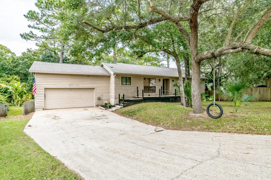 Looking for Acerage in Gulf Breeze?! Nestled on 2.76 acres, on a Cul-de-Sac and in Gulf Breeze shool district in the neighborhood of Sandpiper Village. This home has 3 bedrooms and 2 bathrooms and features an open floor plan for a nice open feel with vaulted ceilings and a fireplace, and lives big. The remodeled kitchen boasts of new appliances, new counter tops, new cabinetry, a breakfast bar and a pantry! There's also a bonus room located near the kitchen that would make a great breakfast nook or an office. Hardwood floors in the dining area and new carpet throughout the living room and bedrooms. Enjoy entertaining on your awesome deck through your sliding glass doors overlooking a lush back yard. The oversized garage has able storage and a workshop space and a wifi garage door opener an