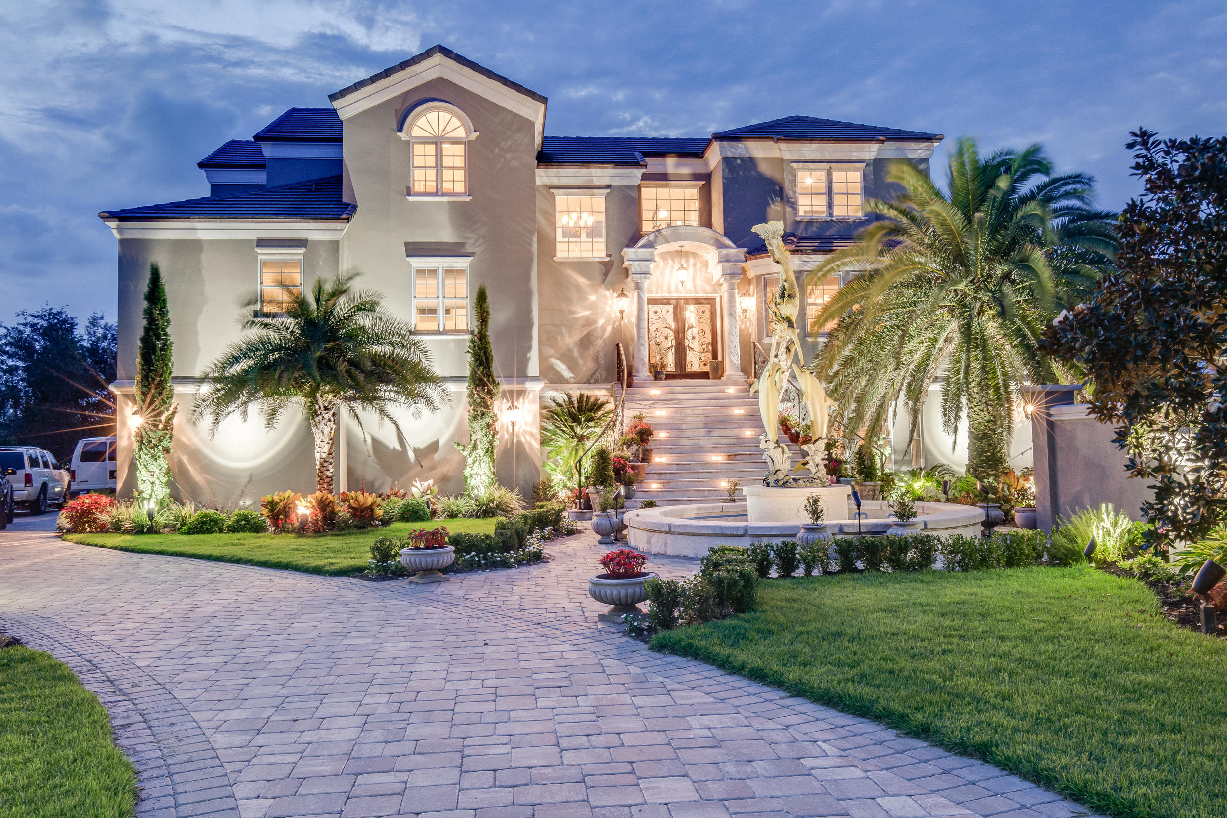 This 5,400+ sq. ft. home is COMPLETELY WALLED although you would never notice it because of the incredible landscaping. Gated twice, once at the entrance to the road and once at the driveway, this impressive estate will be appreciated by the discerning buyer. It sits on a large lot and boasts 13 rooms, 2 master suites, exercise room, dedicated study, billiard's room, butler's pantry and much more on the inside, while on the outside it features a lakefront pool, gulf views, a grand staircase, beautiful gate, beautiful/long driveway, and elegant mermaid fountain. Vacation rentals are allowed if you want to rent and the location is premiere....tucked right in between Seagrove Beach and Alys Beach on Camp Creek Lake.