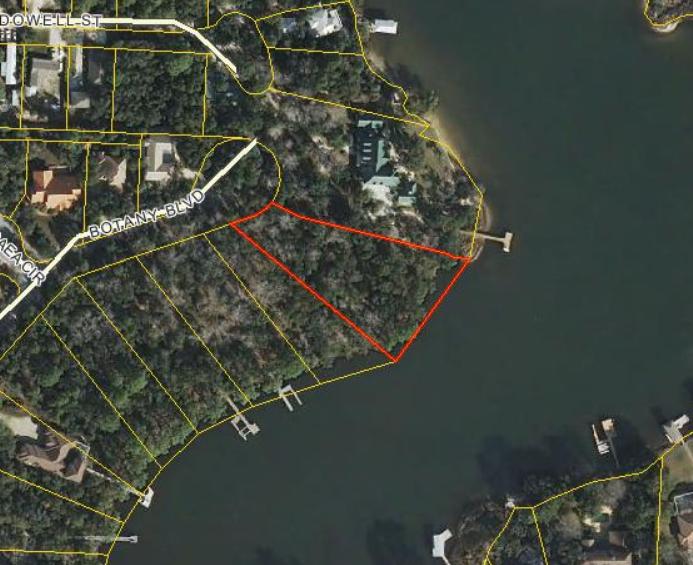 1-1/2 ACRE WATERFRONT LOT , BAY VIEWS, DEEP WATER IN DESIRABLE GATED COMMUMITY. Gorgeous waterfront property to build your dream home. This very large wooded lot sits at the front of the bayou and has views of the bay. It is very private and has wooden fencing down both sides of the property. Botany Bayou is a gated community. Lot 31 is also available at $399,000. Lot 30 is available at $599,000. Purchase both together at $950,000 and enjoy 300' of waterfront living!