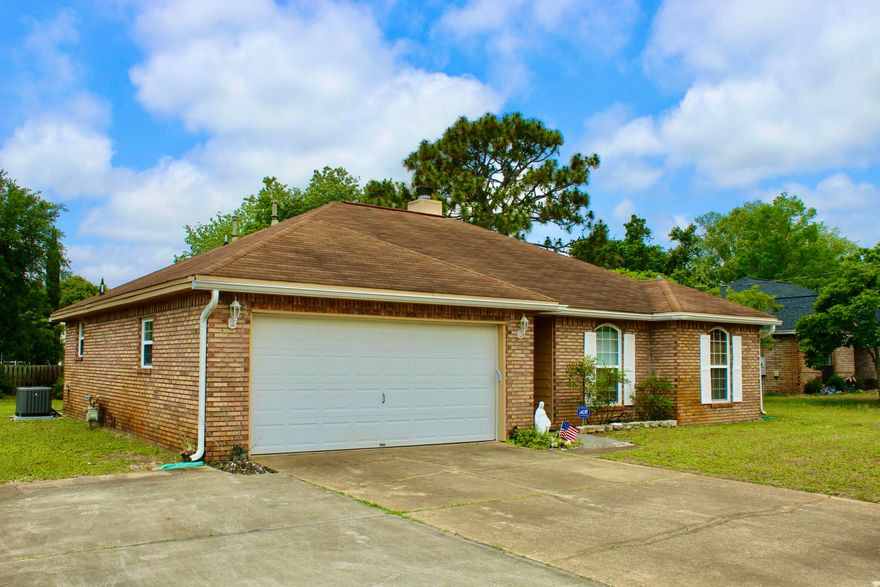 NEW ROOF TO BE INSTALLED PRIOR TO CLOSING! We have a 3 bedroom 2 bath home located in Navarre!  There is hardwood flooring   in all rooms except the kitchen and baths they are tiled. As you walk in the home you will notice to the right is the 3 bedrooms and a hall bath and the master has a on suite bath with his and her sinks and  walk-in closets! The kitchen has stainless microwave and dishwasher. The bathrooms feature cultured marble countertops.  The HVAC was replaced in 2021, Hot Water Heater 2020 new electrical box 2022, glass patio door 2022, smoke detectors in every room, As you walk in the back yard you will notice a large level yard and there is an extended driveway pad in the front.