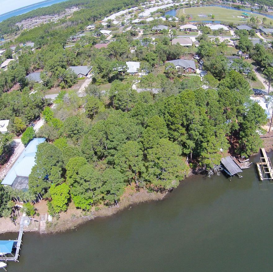 Wow! Check out the drone video!! Great bayou front location along the quiet dead end Buck Road. Quick access to Grand Blvd. shopping, Sacred Heart Hospital and Driftwood Estates Recreational Park. There is NO HOA or build-out time frame so you can build your dream home when you desire. Ideal location for residence with rear living space, outdoor space and dock facing south onto Buck Bayou. Natural Gas lines are already ran along Buck Rd and could easily be connected to Lots 3 & 4. 190 +/- total water front feet...150 ft on Buck Road...sides are different length as waterfront is angled. Lots are also offered for sale separately, Lot 3 for $195K and Lot 4 for $185K.