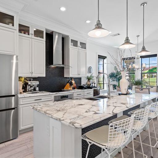 Head and shoulders above the rest, this turn key, luxury  home in the heart of Sandestin offers a level of finish and attention to detail unmatched in the community of Villa Lago.Immediately upon entering the home you are greeted by the sweeping foyer and views through the kitchen. The kitchen is finished with brand new, top of the line appliances, lighting and cabinetry.4 beds, 4 baths, private office off the master, tile flooring throughout the entire home, matte white porcelain in all bedrooms and bathrooms, high end furnishings, brand new appliances, a new Star golf cart, and so much more make this the truly turnkey home you have been waiting for. See document section for full list of inclusions and finishes