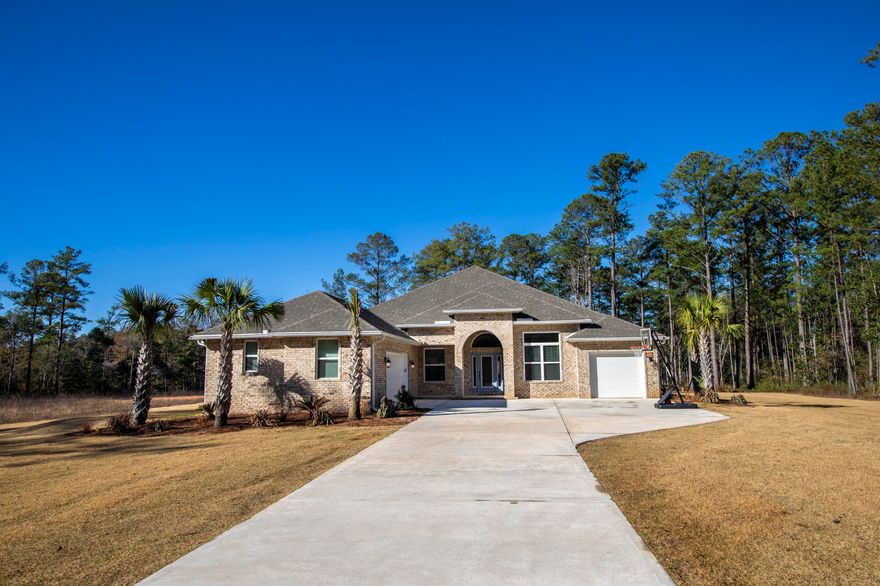 This home has it all. Set on a rare 3.2 acres with no HOA, 279 JW Hollington offers everything you have been looking for. Constructed in late 2021 the home is like new with all of the upgrades. With four large bedrooms, three baths, an oversized laundry room, formal living area /office, dining room, and family room open to a spectacular gourmet kitchen this 3218 sq ft. abode offers plenty of space for its next owners to call home. In addition to the privacy and room to spread out on 3.2 acres, the exterior is all brick, professionally landscaped with irrigation system, and a double garage as well as a full size single garage. On the interior, high ceilings and massive windows allow the natural light to flood in accentuating the open floor plan.