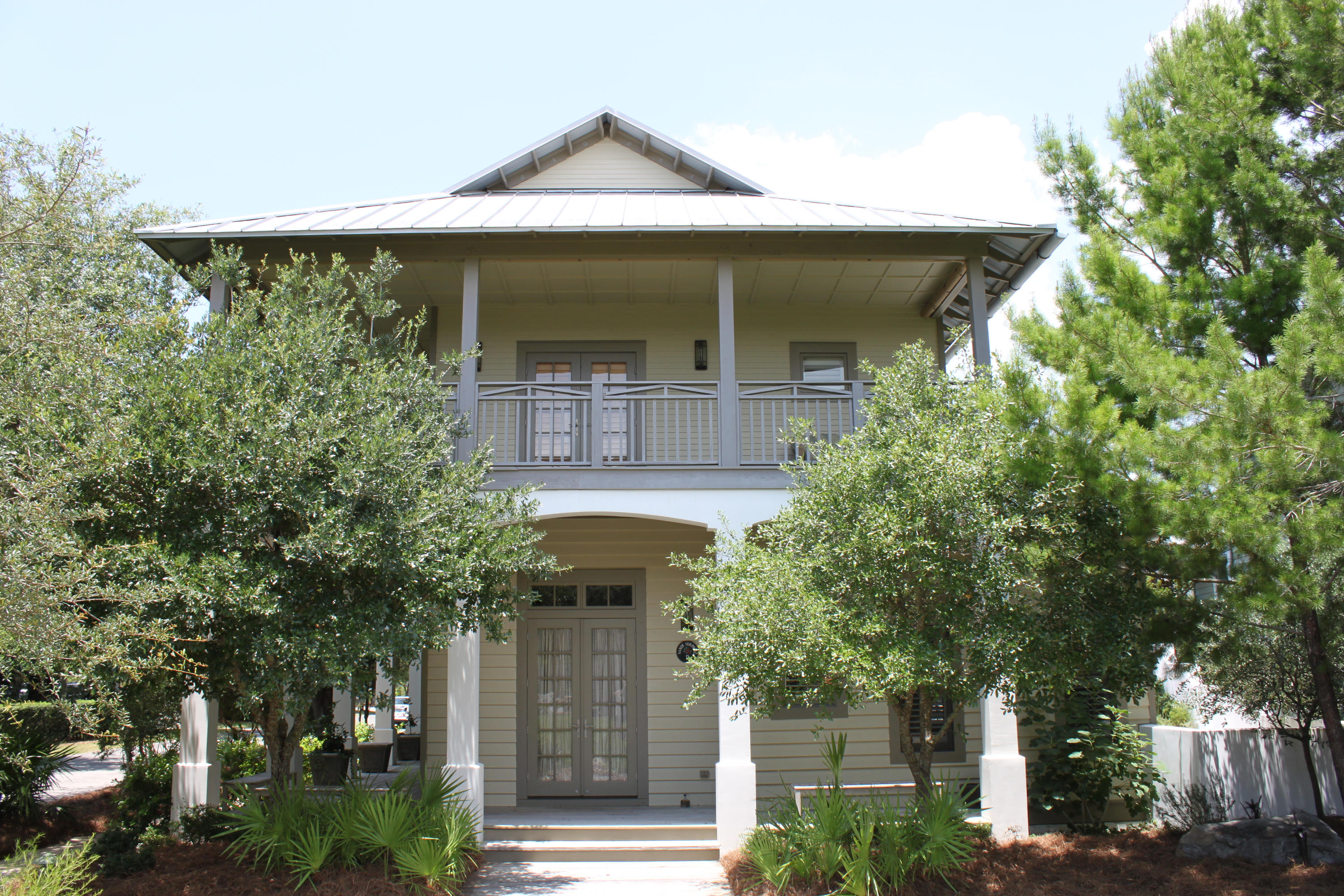 This is it! Everything you would look for in a Rosemary Beach Home is here on a large corner lot facing Bridgetown Park. The main house has a 1st level open floor plan with living, dining and kitchen inclusive of the owner's bedroom & bath and an foyer/office area. The 2nd level has 3 guest bedrooms each with a private bath plus a gathering and media room. Wrap-around porches on both the 1st and 2nd levels provide a relaxing environment for coastal living at it's finest. Further exterior living will be enjoyed with the circular pool, gas fire pit, zen garden and a complete outdoor kitchen with an all-brick pizza oven. The double car garage and carriage house adds even more to this wonderful home complete with living area, kitchen, bedroom, bath and private courtyard area.