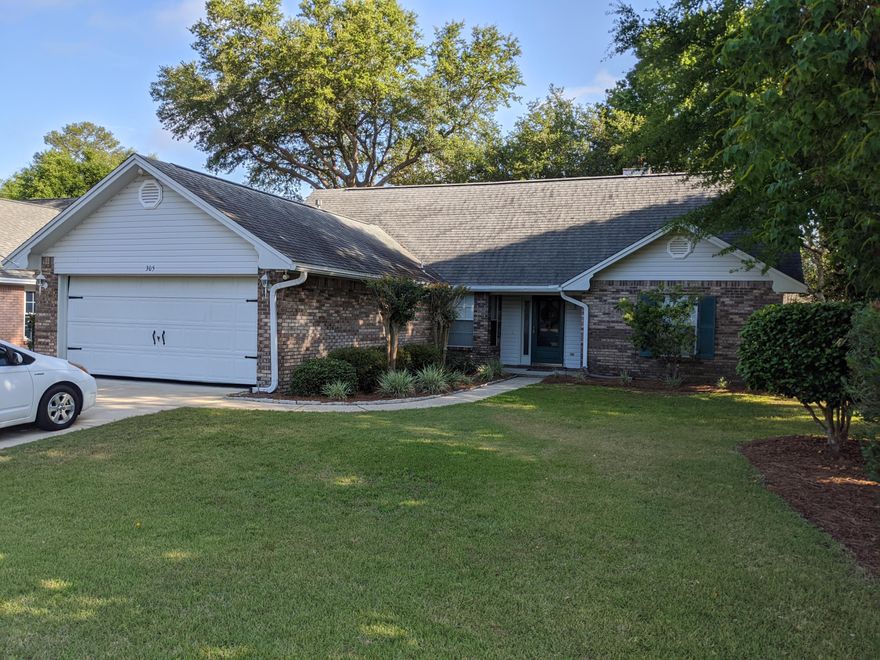 Super house in a premium location! Walking distance to elementary school and local stores. This former Parade of Homes model has an excellent use of floor space. The kitchen has tons of storage, granite, new appliances, and an island with a built-in wine rack. The living room has a soaring ceiling, fireplace with gas logs, and french doors which lead out to the screened-in patio. The upstairs bonus room would make a handy office or den. The back yard has a large deck (new decking) for plenty of seating and is surrounded by delightful landscaping. Both bathrooms have been updated. Bluewater Bay has so much to offer: tennis, pools, golf, and a marina. Make this great home yours! The property also has a termite bond and transferrable home warranty with Old Republic Home Warranty