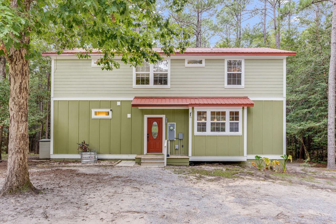 If it's seclusion you're looking for, this is the home for you! Nestled on 2 peaceful acres with a beautiful creek, this 3-bedroom, 3.5-bath home offers country living at its best-just 5 miles from grocery stores, restaurants, and all the conveniences of town, 30 miles to the sugar-white sand beaches of South Walton and 30A, and convenient to Eglin AFB.Every bedroom has its own full bathroom, with an additional guest half bath on the main level. Downstairs you'll find a spacious bedroom with its own full bath and laundry area. Upstairs are two private en-suites, each with a large walk-in closet. The kitchen flows seamlessly into the family and dining areas, complete with stainless steel appliances, a brand-new Wi-Fi-enabled stove with built-in air fryer, and an oversized dining space perfect for entertaining.
Step outside to enjoy two extra-large porches overlooking a canopy of trees and your private backyard, ideal for morning coffee, family gatherings, or evenings watching wildlife like deer and turkeys.
The oversized 2-car garage offers abundant storage, while the additional outbuilding, with existing water hookups from its prior use as a laundry room, provides endless potential as a she-shed, workshop, hobby studio, or guest retreat. The crawl space is fully encapsulated with a dehumidifier and thermostat monitor, while the attic provides even more storage.
Bring your imagination! There's already space for chickens, room for a garden, and plenty of land to make it your own. Wonderful neighbors and a serene setting make this a true hidden gem. Come see your new home today!