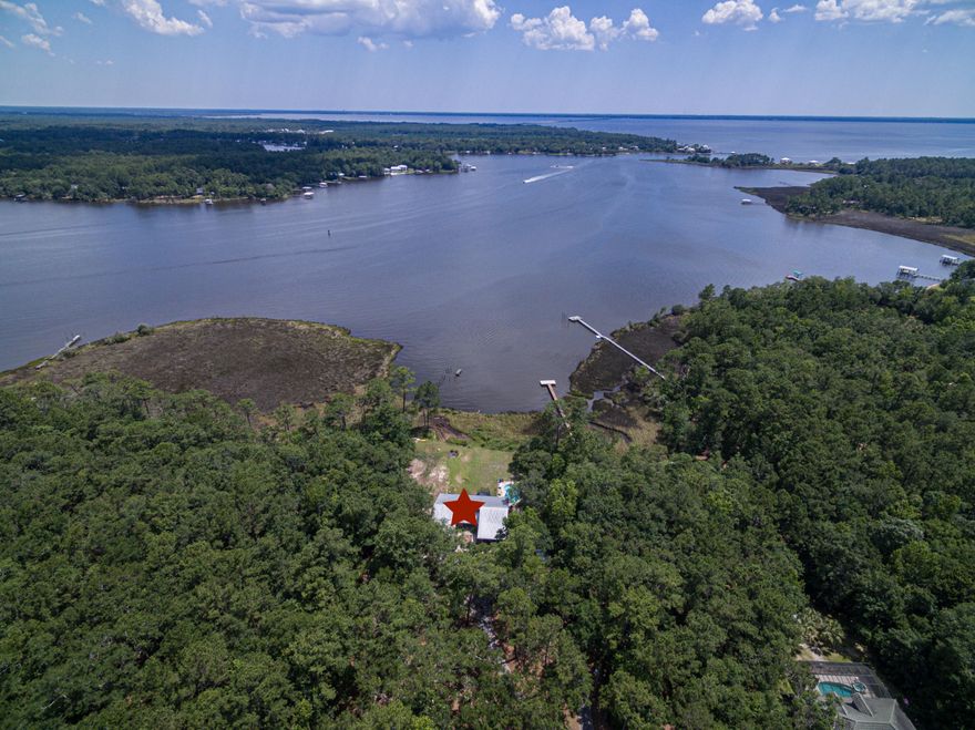 Owners said bring all offers...Fantastic opportunity to own this 3.11 ac waterfront property, Property is annexed into City of Freeport and rezoned from Rural Village (RV) to Med Density Residential (R-2) which allows 8 units per acres. House being offered ''as is'' with the right to inspect. . Great for a builder to build a small waterfront community. SELLER LOOKING AT ALL OFFERS NOW, BRING THEM