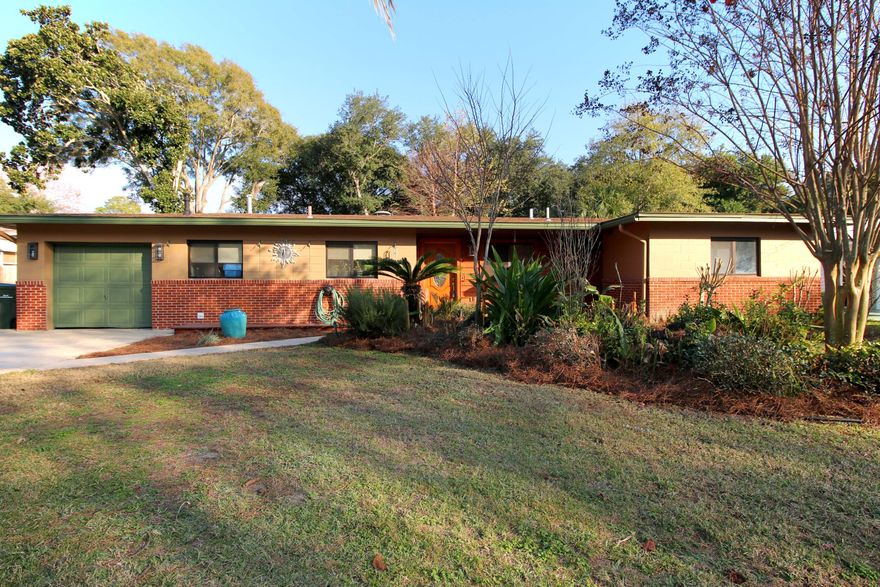 Completely updated 5 BR home in popular Elliott Point. Bamboo wood flooring in living area & hallway, carpet in bedrooms, & tumbled travertine in kitchen & guest bath. Beautiful kitchen with hickory cabinets, granite countertops, stainless appliances, gas cooktop, under cabinet lighting, travertine floors, & all appliances including front-loading washer/dryer convey. Other updates: windows, wiring, plumbing, gas tankless water heater, hard-wired for internet/wifi, knock-down ceilings & walls, crown molding, arched door openings, panel doors w/arch, updated lighting, & freshly painted. Enlarged master suite with huge walk-in closet & French doors to lush back yard w/tranquil koi pond. Guest bath has granite countertop, travertine floor & walk-in shower. Large fenced-in back yard has