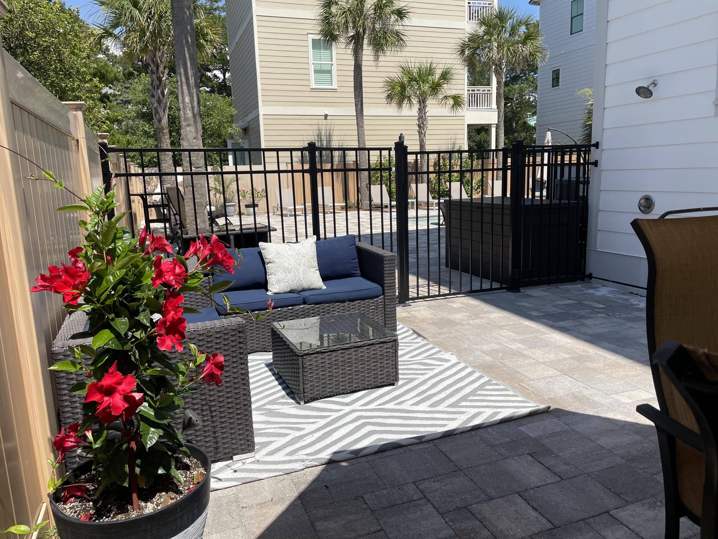 NO HOA DOUBLE LOT! Rare opportunity to own this double lot gem with oversized PRIVATE salt water heated pool/ hot tub just steps to Gulf Coast, shopping and restaurants. Proven rental history with rave reviews!This beautiful 3 story 4 Bdrm 3.5 bath home with outdoor shower is a vacation dream! Private balconies off second and third floors front bedrooms with views of Gulf Coast! Open concept main floor living area. Laundry on second floor. Tile floor and granite countertops throughout. Stainless steel appliances. Rinnai tankless hot water system. Irrigation system with drip lines throughout patio area. Insulated floors for sound proofing. Remote Wi-Fi Hayward system for pool. Control heating of pool/hot tub etc from an App! Fire safety lights by staircases. Parking for 3Lg one small.