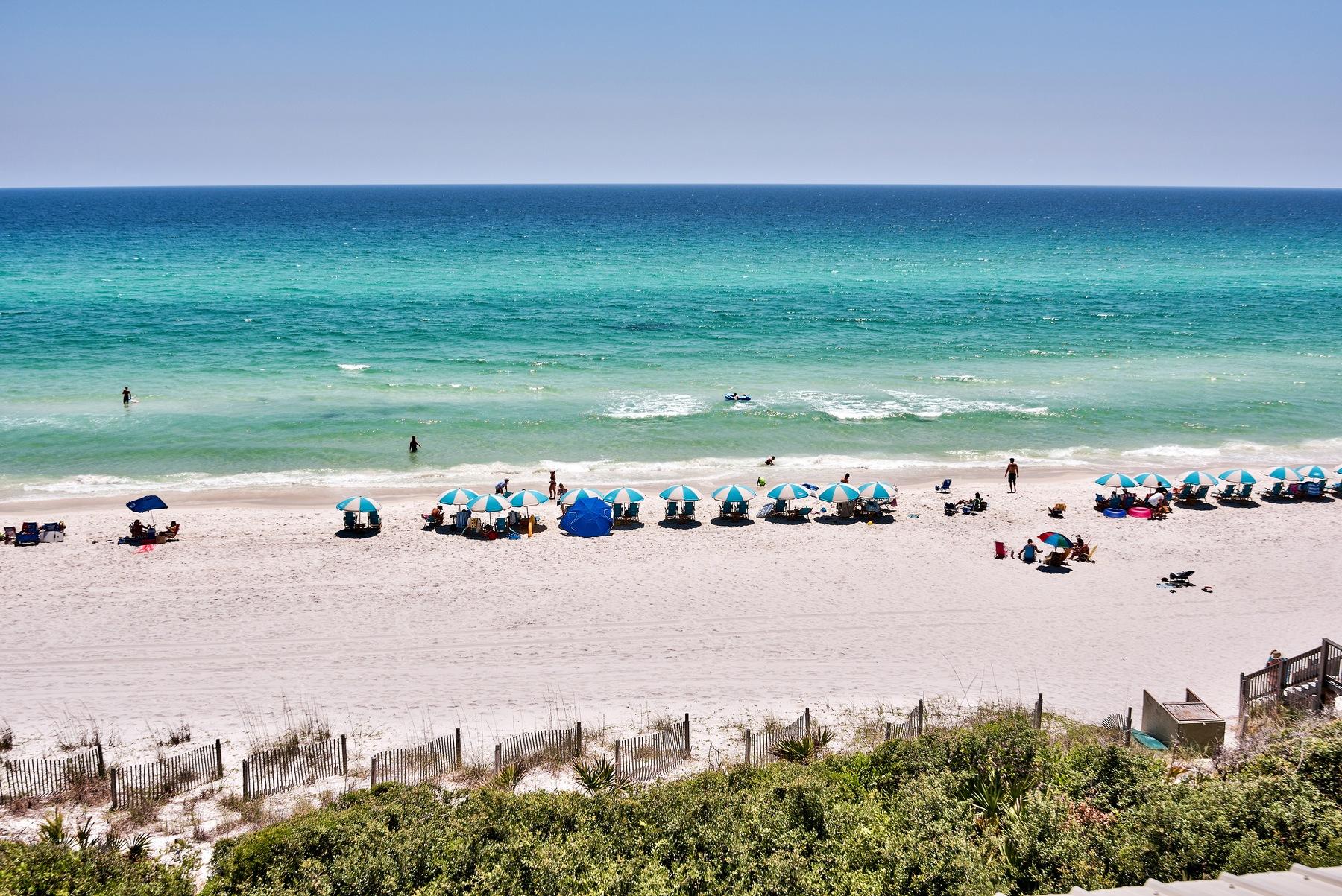 This gulf front home is perched atop a bluff within a private neighborhood in between fiercely popular Rosemary Beach and Alys Beach. Enjoy the unique atmospheres of these new urbanism communities on the desirable east end of Scenic Highway 30A, and then retreat behind the gates of Water's Edge, whose 36 homes share approximately 265 feet of beach front. The rare dune topography allows the emerald waters of the Gulf of Mexico to be seen even from the open first floor living areas. An elevator eases movement between its three floors. A gulf front sun room spans the width of the second floor, access to which is shared by two bedrooms, one of which being the master. Located beside the enclosed two-car garage is a private entrance to the in-law suite.