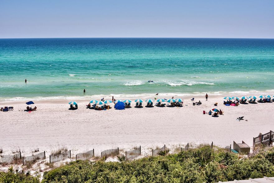 This gulf front home is perched atop a bluff within a private neighborhood in between fiercely popular Rosemary Beach and Alys Beach. Enjoy the unique atmospheres of these new urbanism communities on the desirable east end of Scenic Highway 30A, and then retreat behind the gates of Water's Edge, whose 36 homes share approximately 265 feet of beach front. The rare dune topography allows the emerald waters of the Gulf of Mexico to be seen even from the open first floor living areas. An elevator eases movement between its three floors. A gulf front sun room spans the width of the second floor, access to which is shared by two bedrooms, one of which being the master. Located beside the enclosed two-car garage is a private entrance to the in-law suite.