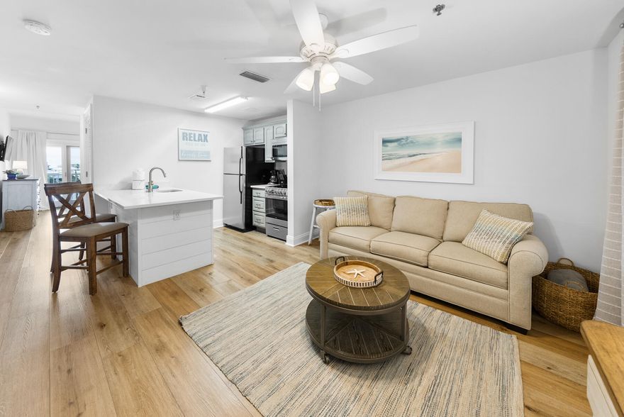 The perfect beach getaway or investment opportunity awaits you in this immaculate, light and airy 1 BR and 1 BA condominium at the Carillon Beach Resort. This newly updated and renovated 4th floor condo has sunrises and sunsets from the balcony that are breath taking! Extensively renovated with LVP flooring throughout, new quartz countertops in the kitchen and bath, shiplap in the bedroom and bath, new white cabinets in the bathroom, gray cabinets in the kitchen, A NEW 24'' stainless steel stove with oven and microwave, upgraded sink, shiplap, new hot water heater 2023, and new furnishings and decor. Unit 409 is one of the rare units with a stove instead of a 2 burner cooktop. The floor plan is the living area is at the front of the  the condo as you enter the front door and the bedroom is located overlooking beautiful Lake Carillon. Carillon Beach Inn is located on the west end of Panama City Beach and only minutes to Pier Park, Lake Powell, Rosemary Beach and all of 30A and their amenities. Carillon Beach Resort amenities include over 3,900 ft. of white sand beaches, 8 beach accesses, 4 community pools, 2 hot tubs, basketball, pickle ball, tennis, yoga studio, spa, fitness center, retail shopping and dining. This is a must see unit! Schedule your showing today!