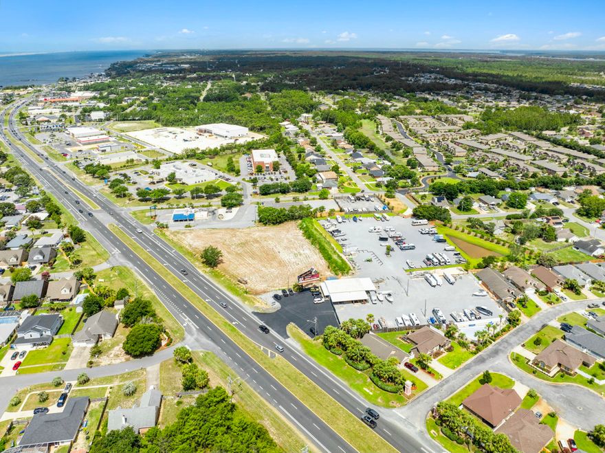 APPROXIMATELY 2+ ACRES OF HIGHLY VISIBLE HWY 98 COMMERCIAL LAND. ZONED HDC. THERE IS 372 FT OF FRONTAGE ON HWY 98.THE NORTH PORTION OF THIS 4.89 ACRE PARCEL HAS BEEN DEVELOPED INTO STORAGE UNITS. THE REMAINING TWO+  ACRES ARE CLEARED AND AVAILABLE FOR PURCHASE.THE LOT SPLIT WILL OCCUR AT CLOSING.THE STORAGE UNITS AND 2 ACRES ADJACENT TO THE EAST ARE ALSO AVAILABLE FOR PURCHASE. CONTACT LISTING AGENT FOR DETAILS.