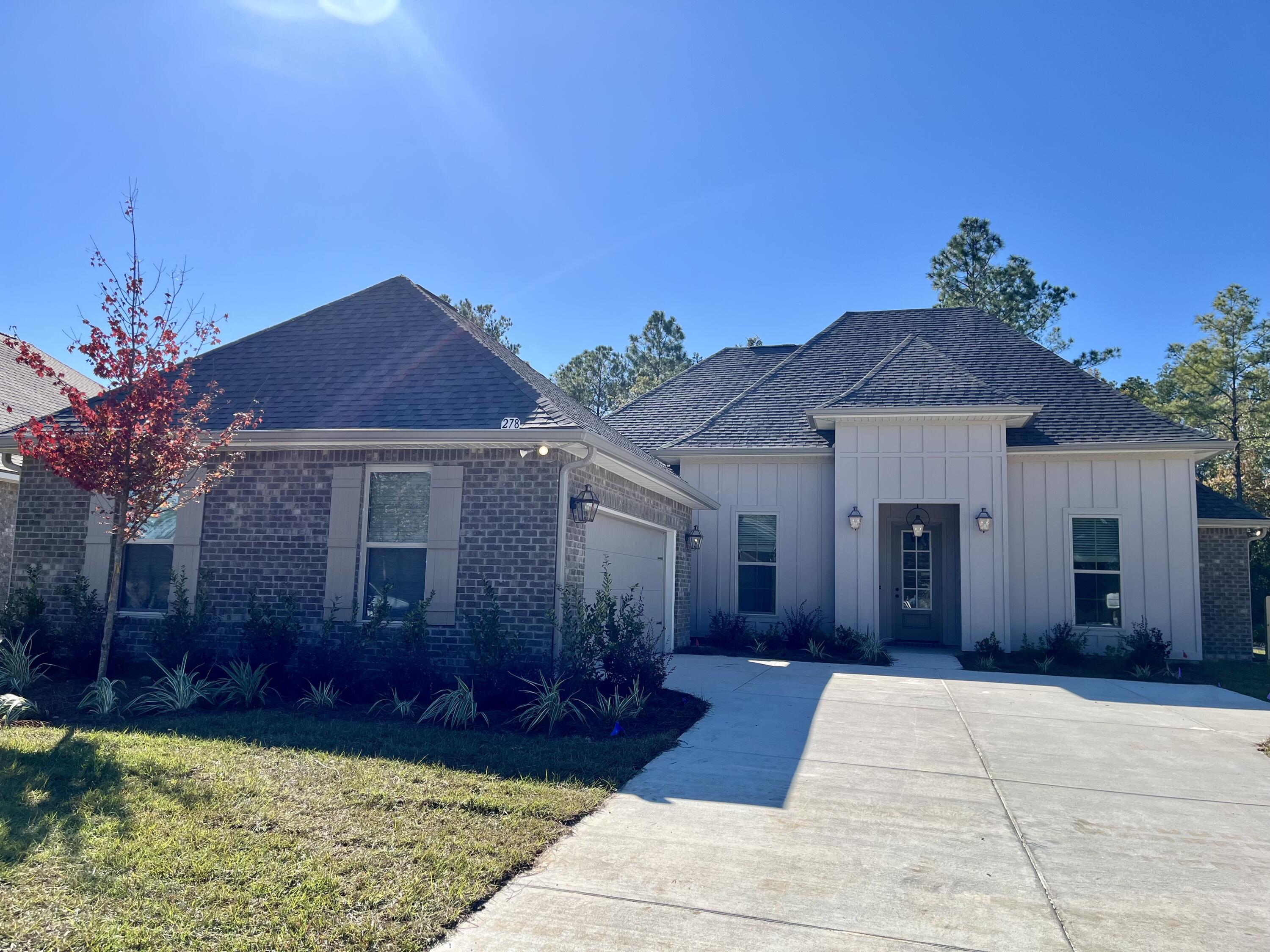 The RENOIR IV H in Starburst at Hammock Bay community offers a 4 bedroom, 3 full bathroom, open design with a breakfast area and flex space. Upgrades added (list attached).  Features: double vanity, garden tub, separate custom tiled shower, and walk-in closet in master bath, kitchen island, walk-in pantry, boot bench and drop zone in mudroom, covered rear patio, recessed lighting, crown molding, framed mirrors in all bathrooms, smart connect Wi-Fi thermostat, smoke/carbon monoxide detectors, landscaping package, architectural 30-year shingles, flood lights, and more!Energy Efficient Features: water heater, electric kitchen appliance package, vinyl low E windows, and more! Energy Star Partner.