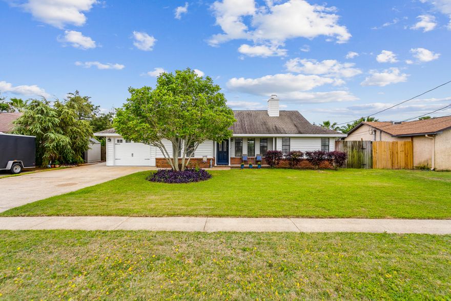 Welcome home! Don't miss out on this charming 2 bdrm/2 bath dream home! Features include large living room with cozy brick fireplace, tile flooring throughout, and tons of natural light, view to the eat-in kitchen featuring granite countertops, backsplash, and breakfast bar, large mud room/laundry room (currently used as an office), master suite with walk in closet, separate shower and soaking tub, ample sized secondary bedroom with attached second bathroom. Outside you'll find a screened in porch, large patio with a firepit and pergola overlooking the fenced in back yard - perfect for entertaining!