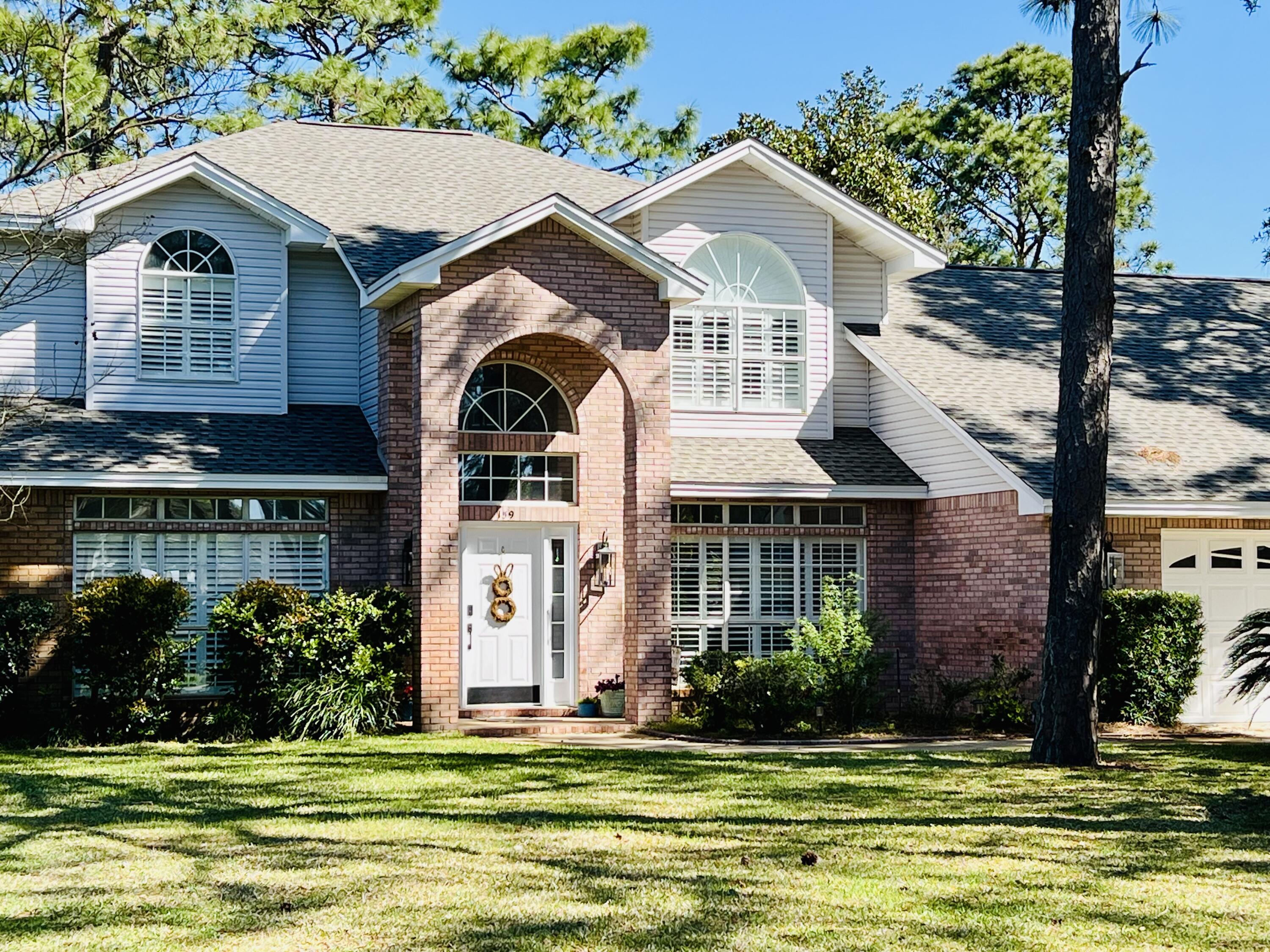 Welcome Home to 159 Baywind Drive! Find this spacious home located deep within the highly desired, guard-gated Southwind neighborhood, in Bluewater Bay. This home boasts a NEWER ROOF (2020), NEW refrigerator, NEW dishwasher, NEW bathroom floors, NO popcorn ceilings, updated kitchen, and a large screened in porch, just perfect for entertaining! Loaded with charm and character, this home has been updated with desirable lighting, new hardware, and a newer water heater (2020). The large master suite is on the 2nd level with an attached balcony for sunset views or sipping your morning coffee. It includes an en-suite bath with dual vanities, separate tub and shower and large walk-in closet.