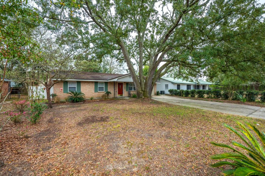Conveniently located less than 1.5 miles to Pensacola International Airport, Cordova Mall and the hospital, this 3 bedroom 2 bathroom home offers an awesome large bonus living space with a wood burning stove, large laundry room with ample storage and Parque wood flooring throughout. You'll enjoy the covered patio (17'x12') and yard building/workshop with power. The kitchen has been updated with Granite counter tops, painted cabinetry with new hardware and stainless steel appliances. The primary bedroom has an en-suite bathroom with a walk-in tiled shower. The additional full bathroom has a shower/tub combo with charming original tile. The fully fenced backyard offers ample shade provided by mature Oak trees. You'll also note the gorgeous majestic Oak tree gracing the front yard! With no HO
