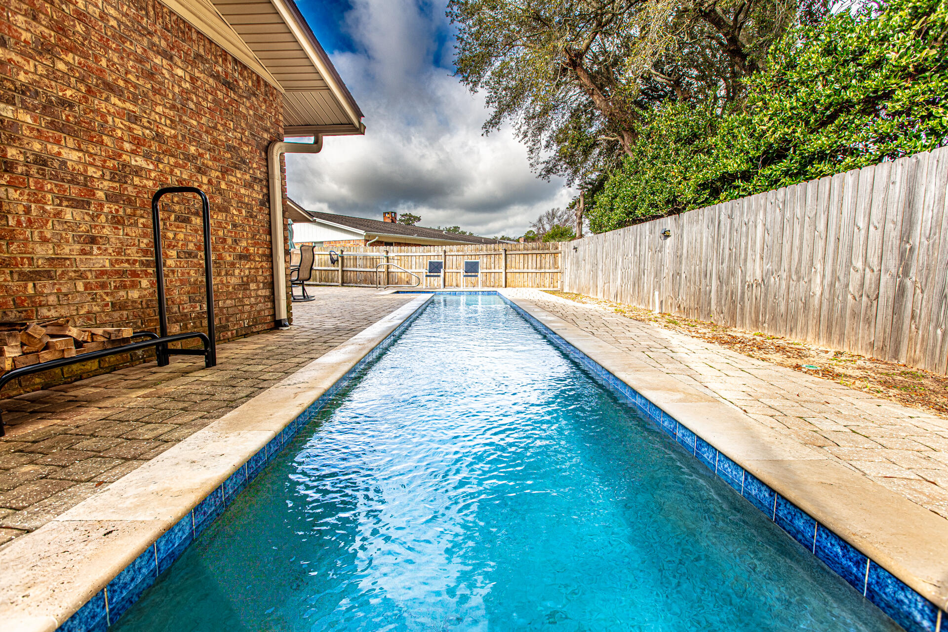 Step into this stunning, contemporary home crafted in 1972, located in the heart of Fort Walton Beach. Nestled near Eglin AFB and Hurlburt Field, this charming residence is surrounded by a golf course, play park, tennis court, and pickleball courts. The property features a luxurious gunite saltwater lap pool, seamlessly blending practicality with leisure. Moreover, it showcases numerous modern updates, including revamped plumbing, wiring, chimney, lighting, fresh paint, a new roof, an HVAC system, a pool pump, and much more! This home is eagerly waiting for its new owner. Schedule an appointment today to experience its allure firsthand! Moreover, the home boasts *NEW LIGHTS AND LIGHT FIXTURES* and brand *NEW APPLIANCES*, including the *WASHER and DRYER* and a total remodel of the*FIRE PLACE INSIDE AND OUT. *FENCED* backyard provides ample space for gardening, pets, or a small storage building. a new ATTIC FAN. A *TRANSFERABLE TERMITE BOND* and a *NEW SPRINKLER PUMP* for the lush green lawn makes this beautiful retreat ready for its next owner. Embrace the possibilities - make this house your own today!" Buyer to verify all data and dimensions.
