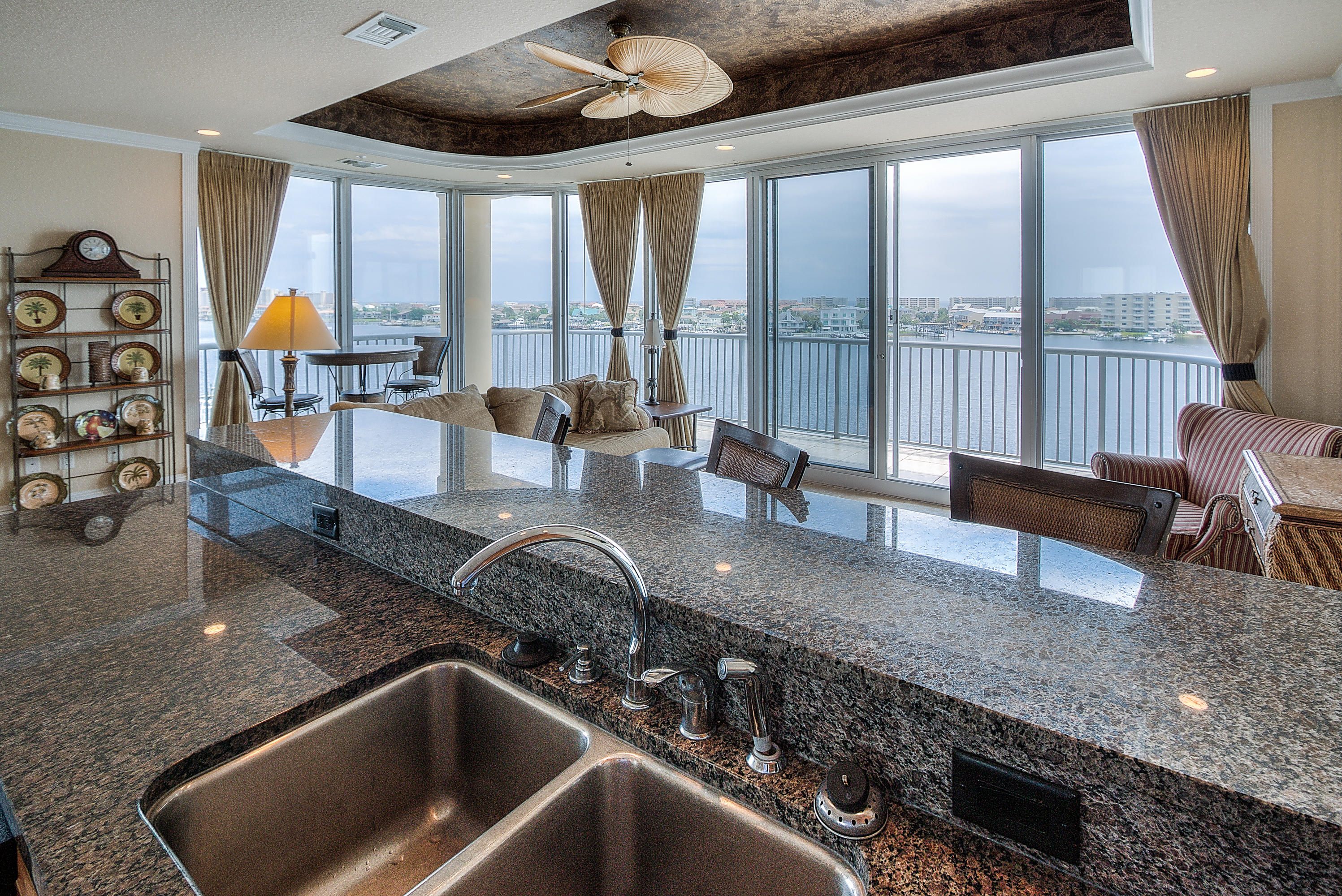 A Boat Lover's Dream unit. This elegant 2br/2bath condo sits right on the harbor and includes a BOAT SLIP with LIFT! Boasting THREE BALCONIES, this unit is a must see for anyone looking for fantastic sunset views. The large wraparound balcony provides spectacular views of the Harbor, Gulf of Mexico, and Destin's East Pass. Featuring 10' tray ceilings, custom cabinets, granite counters, tile floors in living areas, and wet bar. With only 12 units in Destin Harbor Place, you can be sure you will enjoy the privacy and exclusivity you deserve. Other amenities include, private parking with an amazing 30 spaces for the 12 units, gated entry, exercise room, pool, and a ROOFTOP TERRACE!