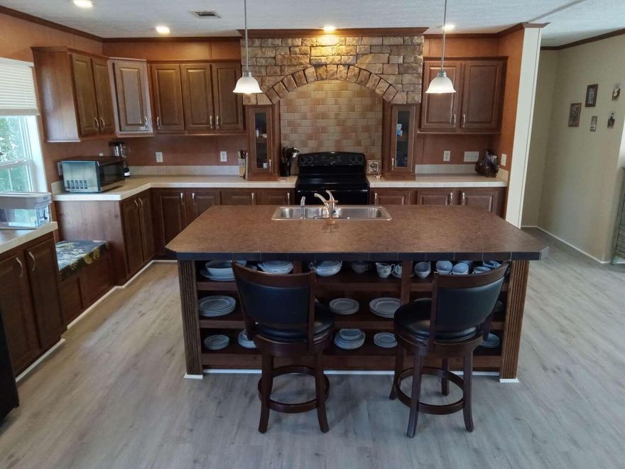 Nice 4br. 21/2ba home on large lot. New roof, open floor plan with new vinyl plank flooring thru-out. Fireplace, seperate dining area, garden tub w/ seperate shower in large master bath, walk-in closet.near beaches and shopping. Sold as is