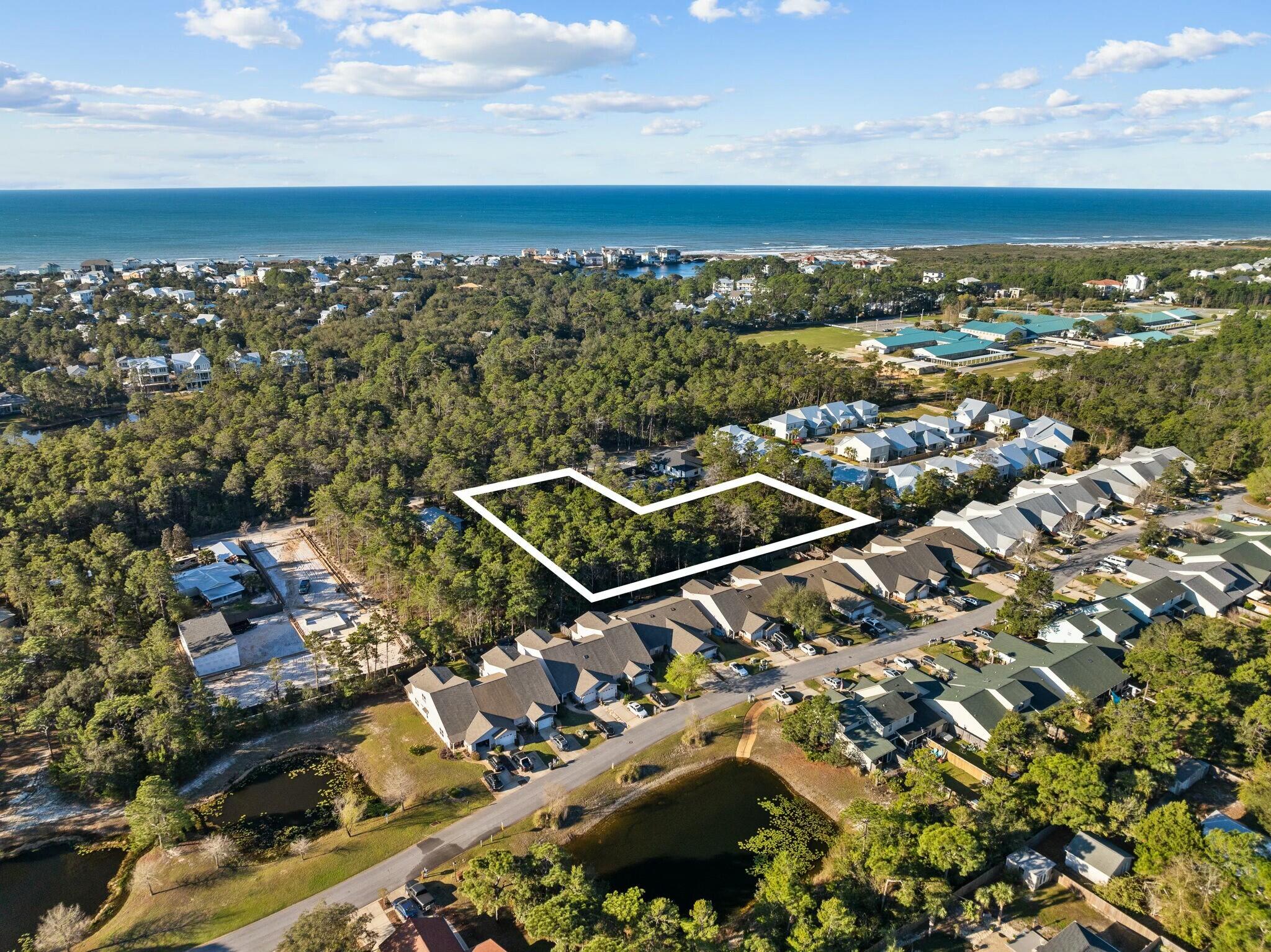 Discover your slice of paradise on this spacious 1.81-acre parcel nestled just off Rachel Road in highly sought-after South Walton County. This rare find offers the perfect balance of peaceful seclusion and proximity to the area's world-class beaches, shopping, dining, and scenic attractions along 30A. Whether you're envisioning a private estate, a serene second home, or exploring development potential, this beautiful wooded lot provides a blank canvas with no HOA restrictions. Enjoy the freedom to build your dream lifestyle just minutes from the emerald waters of the Gulf Coast. Don't miss this exceptional opportunity to own a piece of Florida's fastest-growing coastal region!
