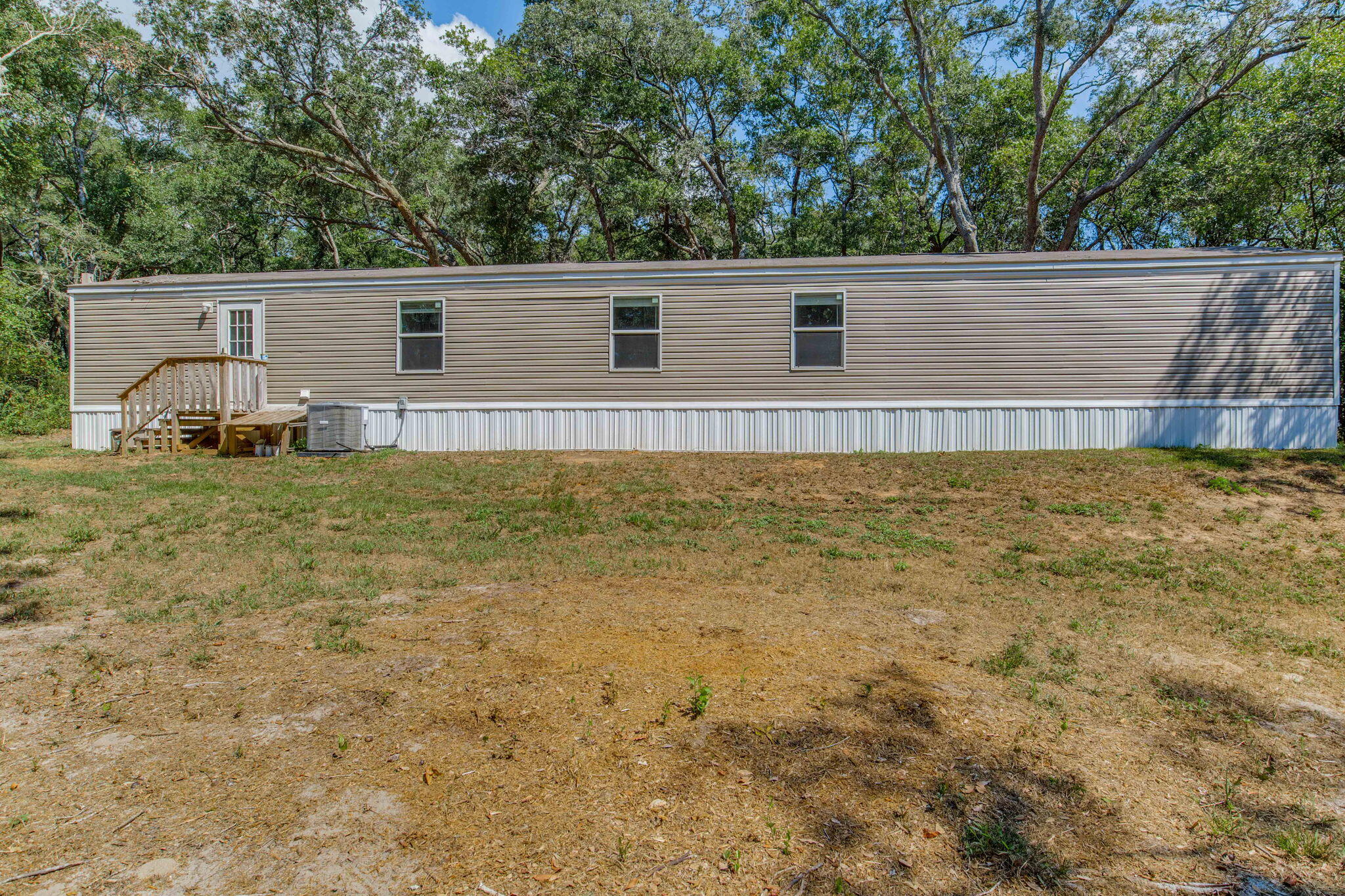 Welcome to your new home sweet home! This charming, newer mobile home sits on nearly half an acre, offering plenty of space and privacy. Boasting 3 spacious bedrooms and 2 full bathrooms, this residence features an inviting open floor plan that's perfect for both relaxing and entertaining. Enjoy modern comforts and a bright, airy atmosphere throughout. With Navarre Beach just minutes away, you can easily embrace the coastal lifestyle. Plus, convenient access to the interstate ensures effortless commuting and travel. Don't miss the chance to own this perfect blend of comfort, convenience, and coastal charm!