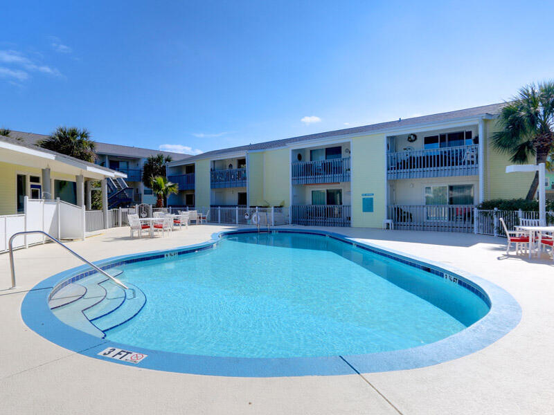 Welcome to your own slice of paradise on Pensacola Beach! This stunning 2 bedroom, 2 bathroom condo is located in the heart of Pensacola Beach, just steps away from the crystal-clear waters of the Gulf of Mexico.As you enter the unit, you'll immediately love the soft, coastal color pallet and coastal decor. Lots of NEW features to appreciate to include NEW furniture in 2022, NEW HVAC (2022), NEW water heater (2022), NEW carpet (2022) and NEW windows installed by the Association within the last 6 months. The spacious living area is perfect for entertaining guests or relaxing after a long day at the beach, and features plenty of natural light, comfortable seating, and a large flat-screen TV.The kitchen is fully equipped with all the stainless steel appliances, counterspace with granite
