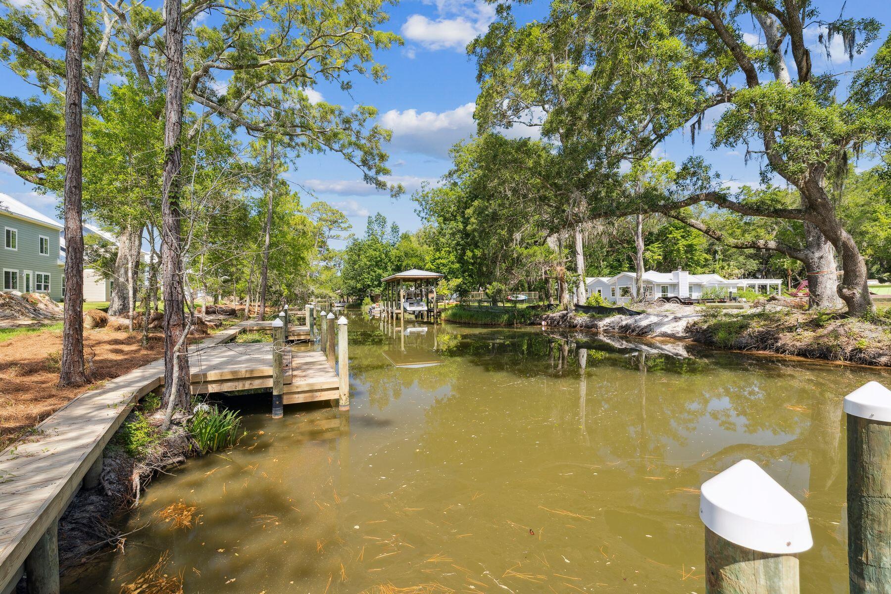 Eagle Bay Luxury Waterfront Residences. Discover an extraordinary collection of waterfront residences nestled along a tranquil canal with direct access to the pristine waters of Choctawhatchee Bay. These meticulously crafted four-bedroom, two-and-a-half-bath homes represent the pinnacle of coastal living in coveted South Walton.Each thoughtfully designed residence showcases an expansive open-concept layout featuring gourmet kitchens with premium finishes and spacious primary suites with private en-suite bathrooms. Wake to endless water views from the dining spaces, primary bedroom, and upper-level bedrooms, creating a constant connection to the bay's natural beauty. Premium amenities include two-car garages with full epoxy floor coating, expansive lots offering abundant space for outdoor entertaining, and direct navigable water access perfect for boating enthusiasts. These new construction homes ensure modern efficiency while providing the perfect backdrop for creating lasting memories with family and friends.
Whether exploring Choctawhatchee Bay or enjoying serene canal views, Eagle Bay offers an unparalleled opportunity to embrace the South Walton waterfront lifestyle. Experience the extraordinary convergence of luxury, location, and value in these exceptional homes.