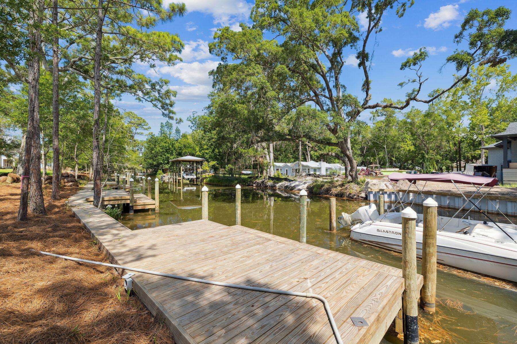 Eagle Bay Luxury Waterfront Residences. Discover an extraordinary collection of waterfront residences nestled along a tranquil canal with direct access to the pristine waters of Choctawhatchee Bay. These meticulously crafted four-bedroom, two-and-a-half-bath homes represent the pinnacle of coastal living in coveted South Walton.Each thoughtfully designed residence showcases an expansive open-concept layout featuring gourmet kitchens with premium finishes and spacious primary suites with private en-suite bathrooms. Wake to endless water views from the dining spaces, primary bedroom, and upper-level bedrooms, creating a constant connection to the bay's natural beauty. Premium amenities include two-car garages with full epoxy floor coating, expansive lots offering abundant space for outdoor entertaining, and direct navigable water access perfect for boating enthusiasts. These new construction homes ensure modern efficiency while providing the perfect backdrop for creating lasting memories with family and friends.
Whether exploring Choctawhatchee Bay or enjoying serene canal views, Eagle Bay offers an unparalleled opportunity to embrace the South Walton waterfront lifestyle. Experience the extraordinary convergence of luxury, location, and value in these exceptional homes.
