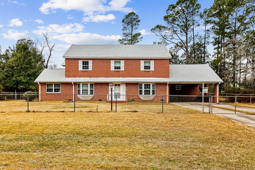Endless potential abounds this stately two-story 3 BD/3.5 BA home situated on a 1 acre lot in the heart of Century FL. With some modifications, this could truly be the dream modern farmhouse that is the current trend at this time! The home has lots of character and features beautiful hardwood floors, oaks stairs and handrail and several custom built-ins. The kitchen boasts updated stainless steel appliances, breakfast bar and nook. Spacious dining room features a bench style seat in the large front window and custom built-ins to hold the fine china. An office space with desk, functional laundry room and half bath are also located downstairs along with a bonus flex space with lots of possibilities - sunroom, family room, exercise space, etc... Upstairs you will find a spacious master suite