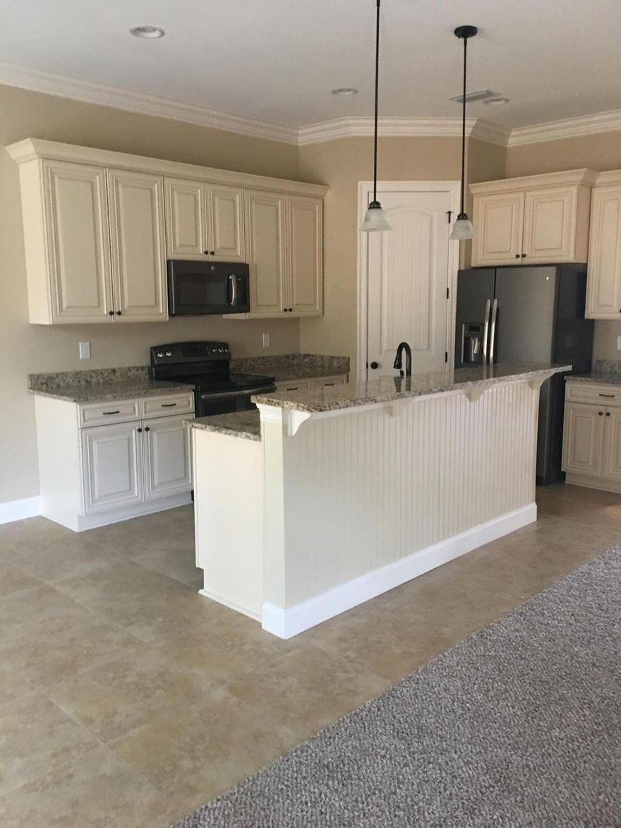 Completion the middle of April. Brand new custom built home by a local, respected builder. You may still have time to choose many selections such as: 3cm QUARTZ OR GRANITE, PAINT COLORS,FLOOR COLORS,OIL RUBBED BRONZE OR SATIN NICKLE FINISHES AND CABINET FINISHES/PROFILES. This open concept 4 bedroom 2 bath floor plan has 9'-10' ceilings throughout.The sleek, sylish, kitchen includes a large center island with SOFT CLOSED, CUSTOM DESIGNED, ALL WOOD CABINETS,SUBWAY TILED BACK SPLASH, GORGEOUS,SLATE FINISHED GE appliances, including a REFRIGERATOR. Popular,and durable, VINYL PLANK flooring to resemble hardwood floors flows throughout the home with the exception of UPGRADED, FRIEZE CARPETING in the bedrooms. 5''BASEBOARDS, and DELUXE COLONIAL CASING ON DOORS. Plus,5'' CROWN