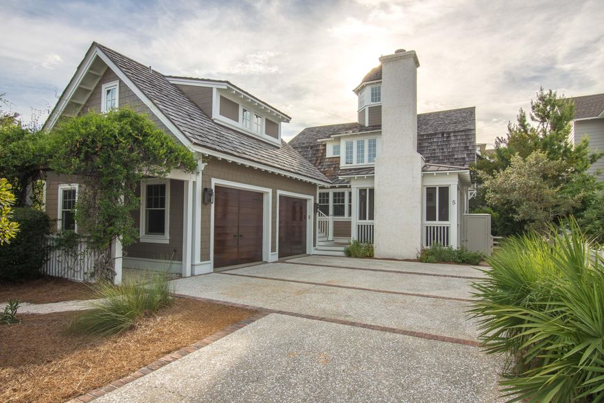Great Price for a home on a large corner lot in WaterSound Beach. This home was built by Gulfview Construction and features a fenced in side yard that is large enough to add a pool. This home features a 2 car garage and a carriage house with kitchen area. Being sold fully furnished with a few exceptions. There is a gourmet kitchen with separate dining area, extensive first floor decks including a screened in back porch with fireplace. Main floor bedroom and also features a bunk room. The home even features a coupla tower with neighborhood and gulf views. Home has never been rented and shows like new.