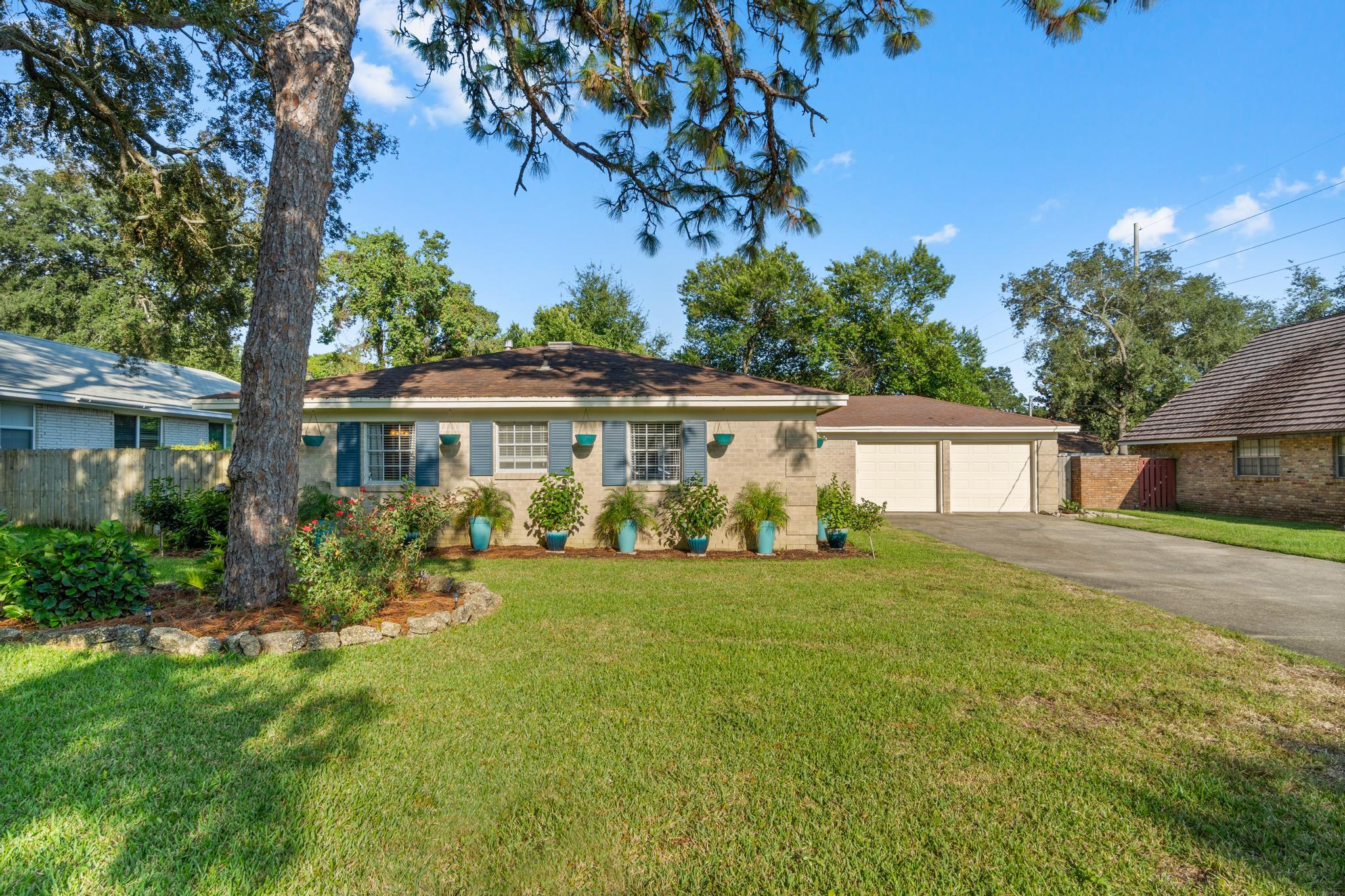 A must see home close to Hurlburt and downtown Fort Walton. close to parks, boat launches, restaurants, beaches, and the base. This well loved home sits on a beautiful lot with mature oak trees in front. New landscaping invites you inside. Once inside this lovely home you will be greeted with bamboo flooring and a large shelving unit for tons of displays. This home has incredible light from all the windows. The kitchen has been completely renovated with solid surface countertops and tile flooring. A large picturesque window in the kitchen above the sink to look out on the lush backyard. There are 4 nice size bedrooms and 2 full bathrooms, all updated. The backyard is very private with mature landscaping and a new deck off the breakfast nook. Two car garage and large driveway.