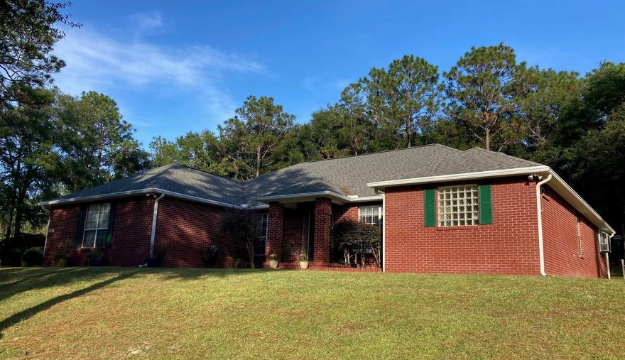 Custom built 4BR/2.5BA brick home on a private 1-acre lot in Mathison Creek Estates with no HOA fees! Home is smoke-free, pet-free, and features a vaulted great room, updated quartz kitchen with gas stove and double pantries, formal dining, and large master suite with his/her walk-ins and attached office. Includes screened porch, fire pit area, large outdoor kennel, deep well and sprinkler system, and attached 2-car garage. Bonus! Large detached brick 3 car garage has a full studio apartment upstairs with full bath, kitchenette and plenty of storage--great for guests or rental income. Large driveway, ample parking, all appliances included, all on a quiet wooded setting. Relax on the screened porch and watch the deer!Owner is a licensed Real Estate Broker in the State of Florida. Exquisite Estate Living Awaits in Mathison Creek Estates!

Welcome to your dream home, a custom quality built house nestled on a sprawling wooded acre within the desirable Mathison Creek Estates! This exceptional 4-bedroom, 2.5-bath residence offers over 2500 square feet of meticulously maintained living space, blending comfort, style, and unparalleled functionality, all within a quiet and friendly neighborhood where every lot is a wooded acre of peaceful privacy and no HOA fees!

Step inside and be captivated by the vaulted great room, perfect for gatherings and creating lasting memories. The heart of the home is the stunning, updated kitchen, featuring quartz countertops, ample counter space, a gas stove, microwave, and two large convenient pantriesa chef's dream! Enjoy casual meals in the sunny eat-in kitchen with its charming bay window, or host elegant dinners in the formal dining area, graced with a sophisticated double tray ceiling and decorative columns. 

Retreat to the extra-large luxurious master suite, boasting tray ceilings, two large his and her walk-in closets, and a beautifully updated master bath with stunning quartz countertops, double vanities, extra clothing storage, and enclosed toilet area. An inviting office directly connected to the master suite through French doors boosts a large window and garden window overlooking the wooded back yard and provides the perfect space for remote work or creative pursuits. The additional three bedrooms offer plenty of space with windows and closets for family or guests.

Beyond the main house, discover a wealth of amenities designed for comfortable living and entertaining. A detached 3 car garage with 3 garage doors provides ample space for vehicles and hobbies, complete with a beautiful studio apartment above, featuring a full bath and a kitchenette with refrigerator - perfect for guests, in-laws, or rental income potential. Enjoy the serenity of the large screened-in porch with plenty of room for a hot tub.  The backyard also includes a fire pit area, a pergola, a swing, a spacious outdoor kennel, and a fenced in area for gardening.

This property is brimming with other desirable features including: a large 2-car attached garage, laundry room, natural gas fireplace, 6 zone sprinkler system, and a reliable deep well with a newer pump and tank. All appliances are included, including two refrigerators, a gas stove, microwave, washer and dryer, as well as all window blinds. Workbenches in both garages provide the perfect space for DIY projects including lots of additional cabinet space in the detached garage.

This is more than just a house; it's a lifestyle estate with a total of 5 bedrooms, 3.5 baths, garage space for 5 cars, plenty of driveway with additional parking spaces, and an overabundance of closets and storage space! Don't miss the opportunity to own this exceptional estate in the highly sought-after Mathison Creek Estates! Schedule your private showing today!
