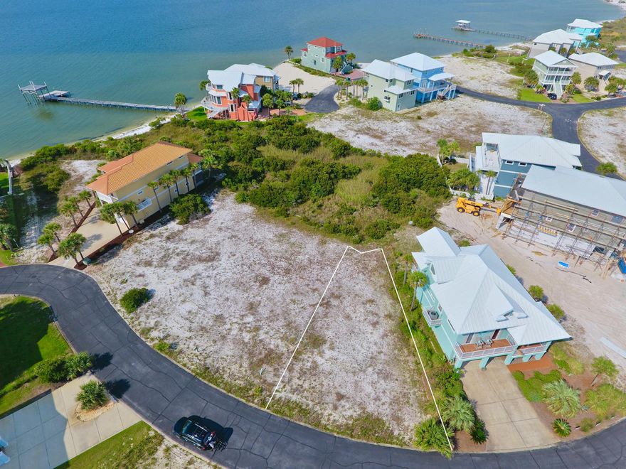 Navarre Beach Lot with WATERVIEWS backing up to Conservation area on the Santa Rosa Sound. Enjoy the Sound views from the rear of the property and potential Gulf views with balcony in front. This is the place to build your dream home or vacation home in the quiet & Gated neighborhood of Caribbean Isles, featuring with street lights and underground utilities. Some amenities include a community pool, tennis courts, and hot tub. Caribbean Isles is bordered by 30 acres of county-owned beach land to the west and the majestic Santa Rosa Sound to the north. Easy access to the Gulf of Mexico beach access, bike trails, gulf island national seashore and more. Caribbean Isles is a well-maintained community where you can enjoy gorgeous sunsets & lasting memories, Click ''More.