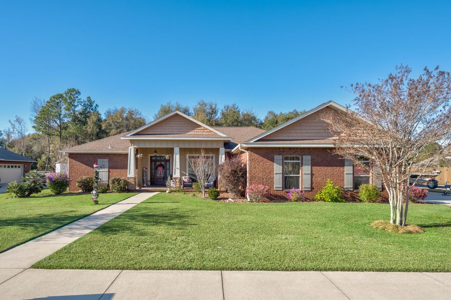 Welcome to your ideal home in a serene setting! This spacious brick residence boasts 3 bedrooms, 2 bathrooms, and sits on a generous .39-acre lot with a sprawling backyard that offers plenty of space for your dreams to come to life.The open floor plan and thoughtfully designed split bedroom layout provide both functionality and privacy. As you step inside, you'll immediately notice the inviting gas fireplace, creating a cozy atmosphere in the heart of the home. Trayed ceilings adorned with venetian plaster decor add an elegant touch throughout the house.The kitchen is a chef's delight, featuring custom cabinetry, sleek granite countertops, and top-of-the-line stainless steel appliances. Whether you're preparing daily meals or hosting gatherings, this kitchen is sure to impress.