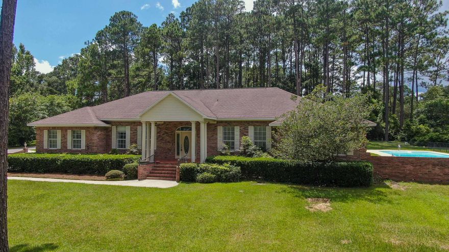 Remarkable all brick, estate pool home positioned atop an estate size 2.6 acre lot in one of the oldest , most distinguished non-HOA neighborhoods in DeFuniak Springs: Pine Shores. You can't miss the excellence in construction and the attention to detail. This sprawling, flexible floor plan offers a myriad of options, offering everyone their own space; whether it is 1 or 2 private offices or extra bedrooms for guests or multigenerational households. High ceilings, crown moulding throughout, double trey ceiling in living room, sprawling brick gas fireplace and surround sound are just a few of the extras you will discover in this exceptional home. The master suite takes his and hers to a new level - with all separate his/hers closets, vanities, water closets, and tub/shower. You have access